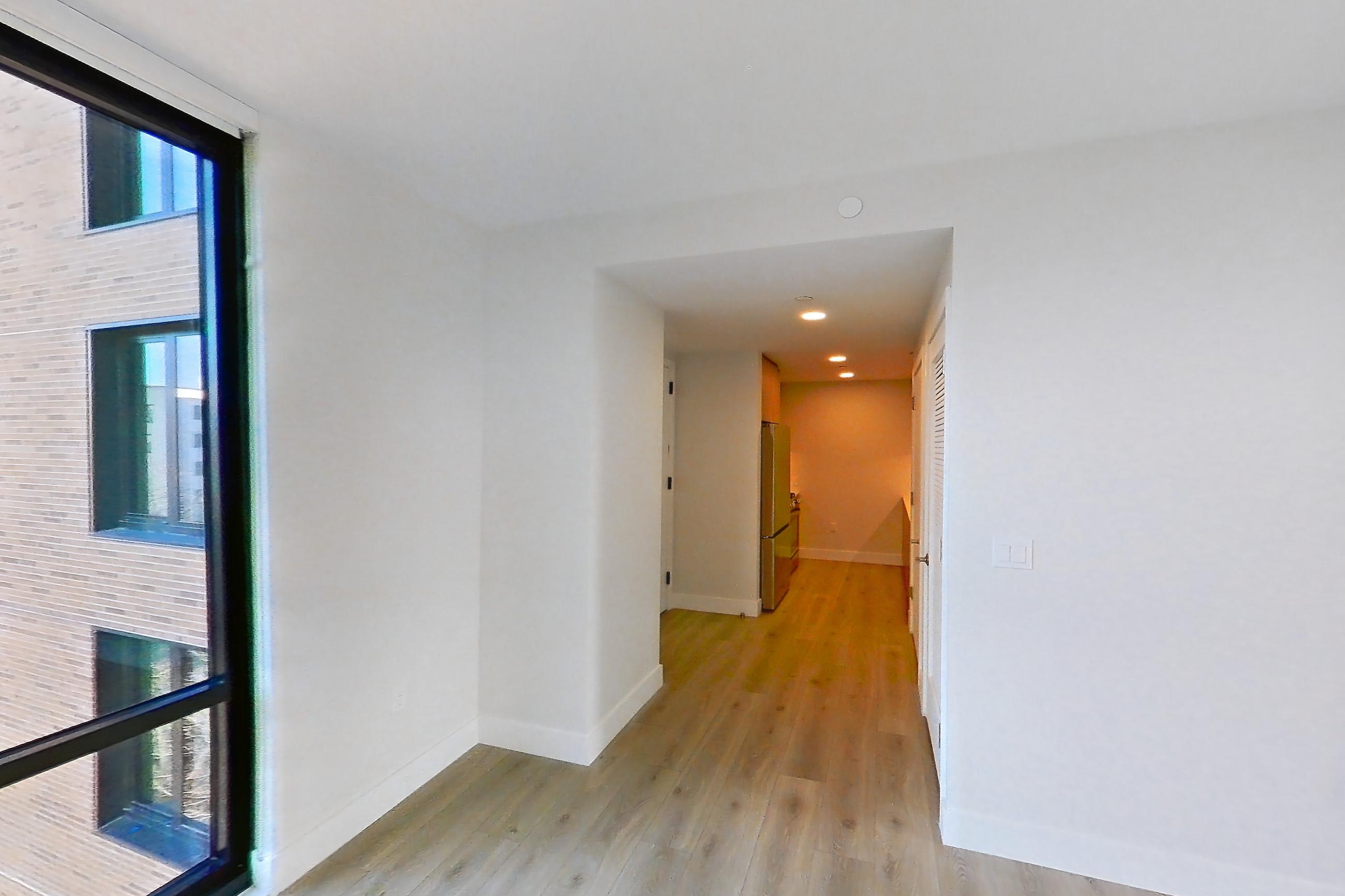 Living room with light wood-finish flooring, Apartment 0637 at Loden