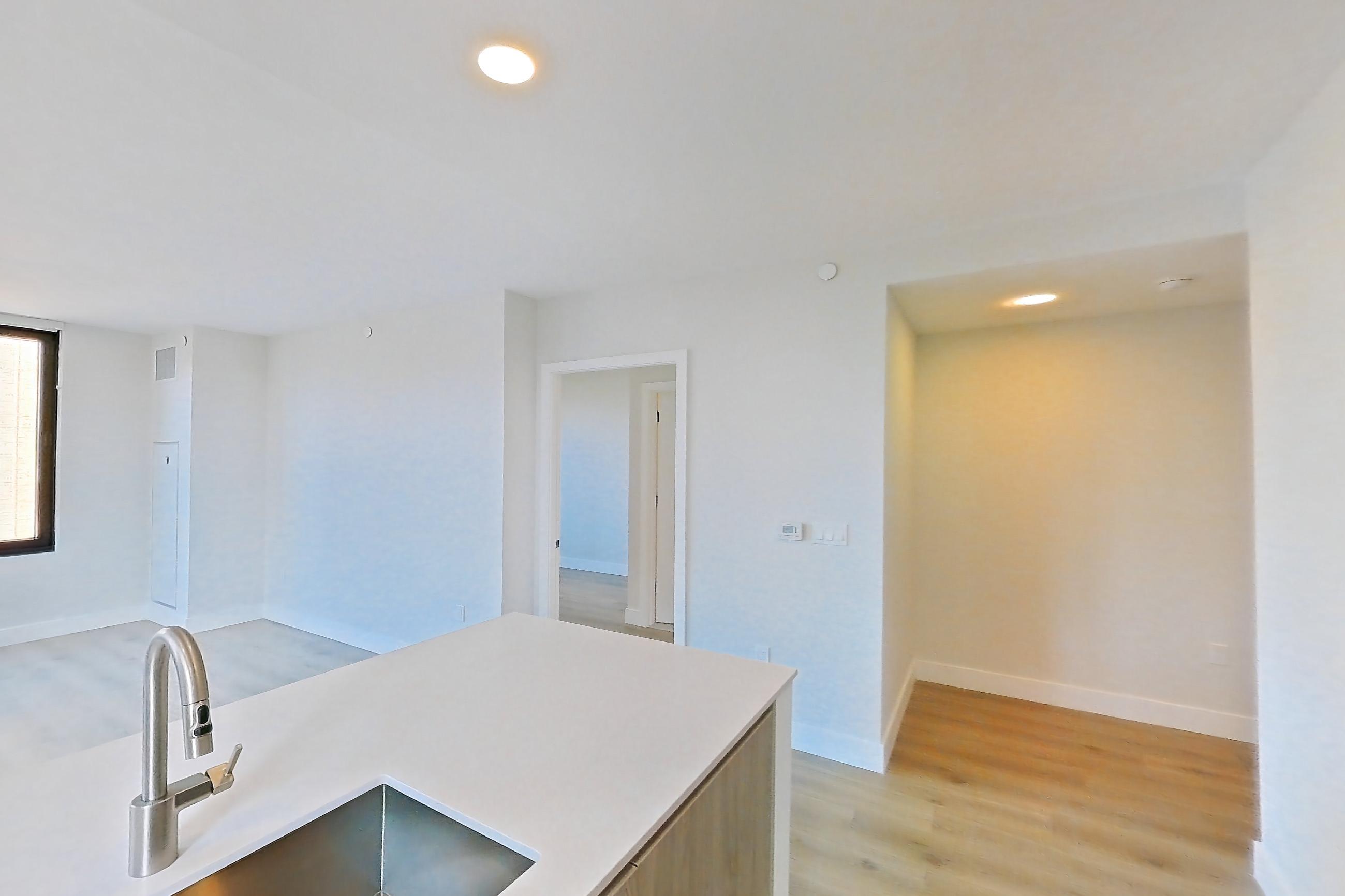 Kitchen with gas range, light wood-finish flooring, oven/range, and stainless steel appliances, Apartment 0638 at Loden