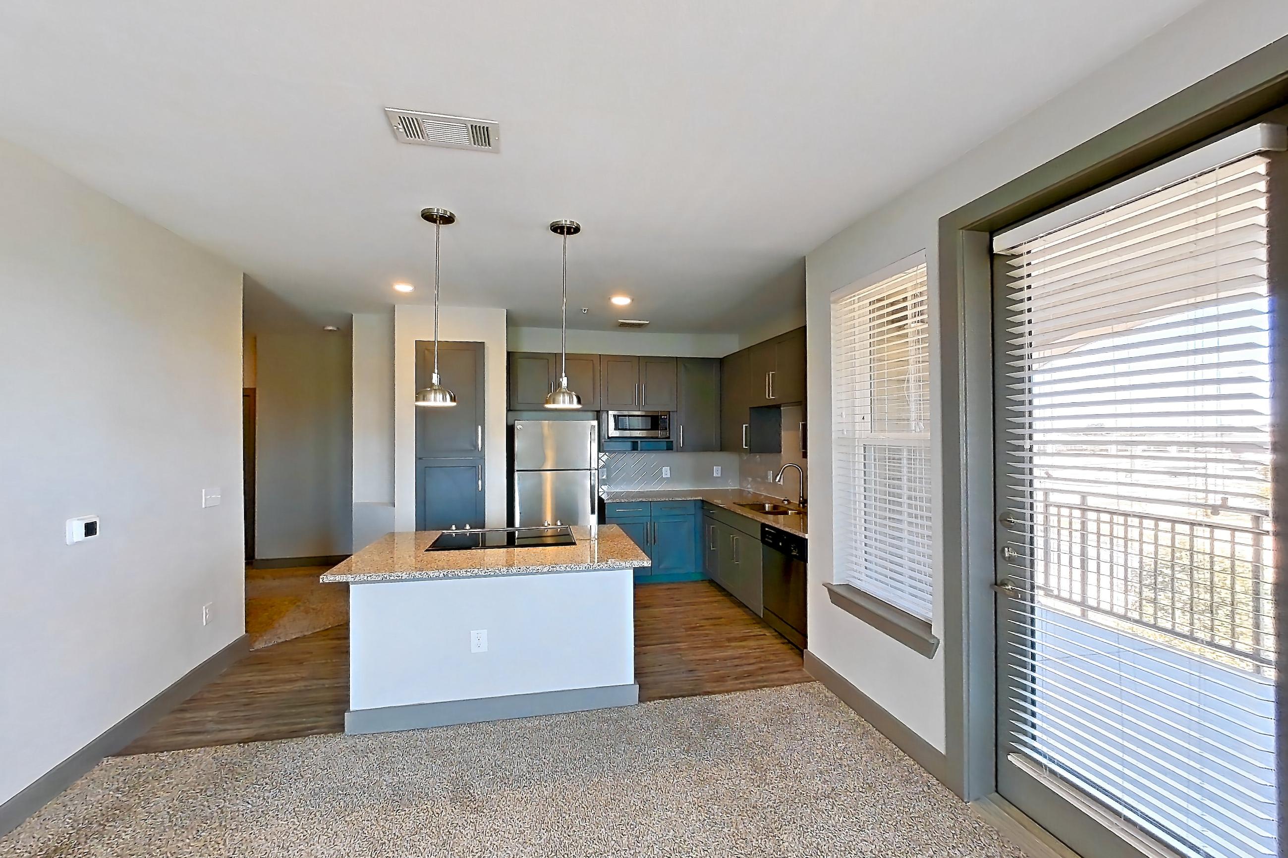 Living room in a 2C floor plan apartment, representative of Apartment 01209 at Embree Hill