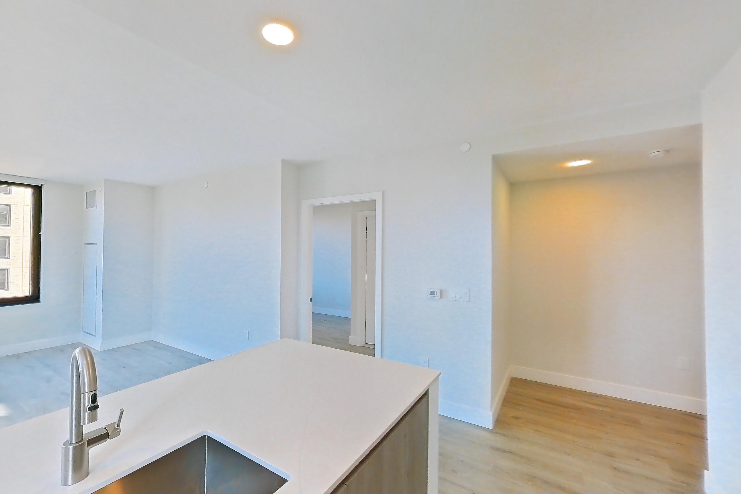 Kitchen with gas range, light wood-finish flooring, oven/range, and stainless steel appliances, Apartment 738 at Loden