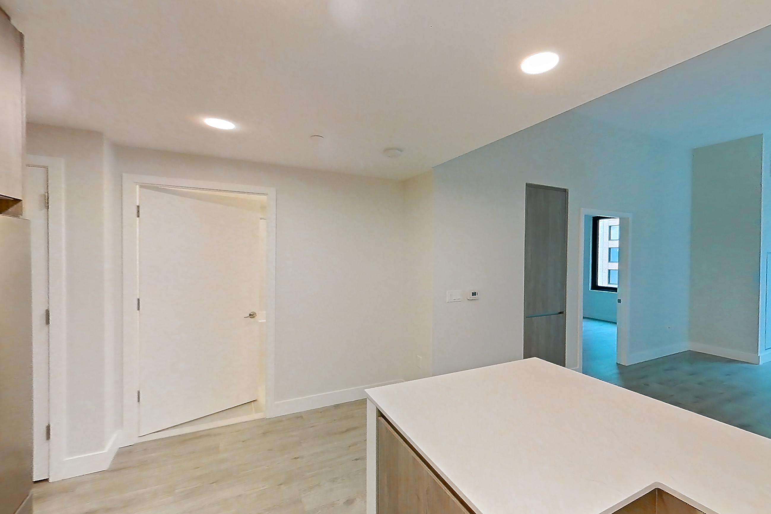 Kitchen with gas range, light wood-finish flooring, oven/range, and stainless steel appliances, Apartment 0931 at Loden