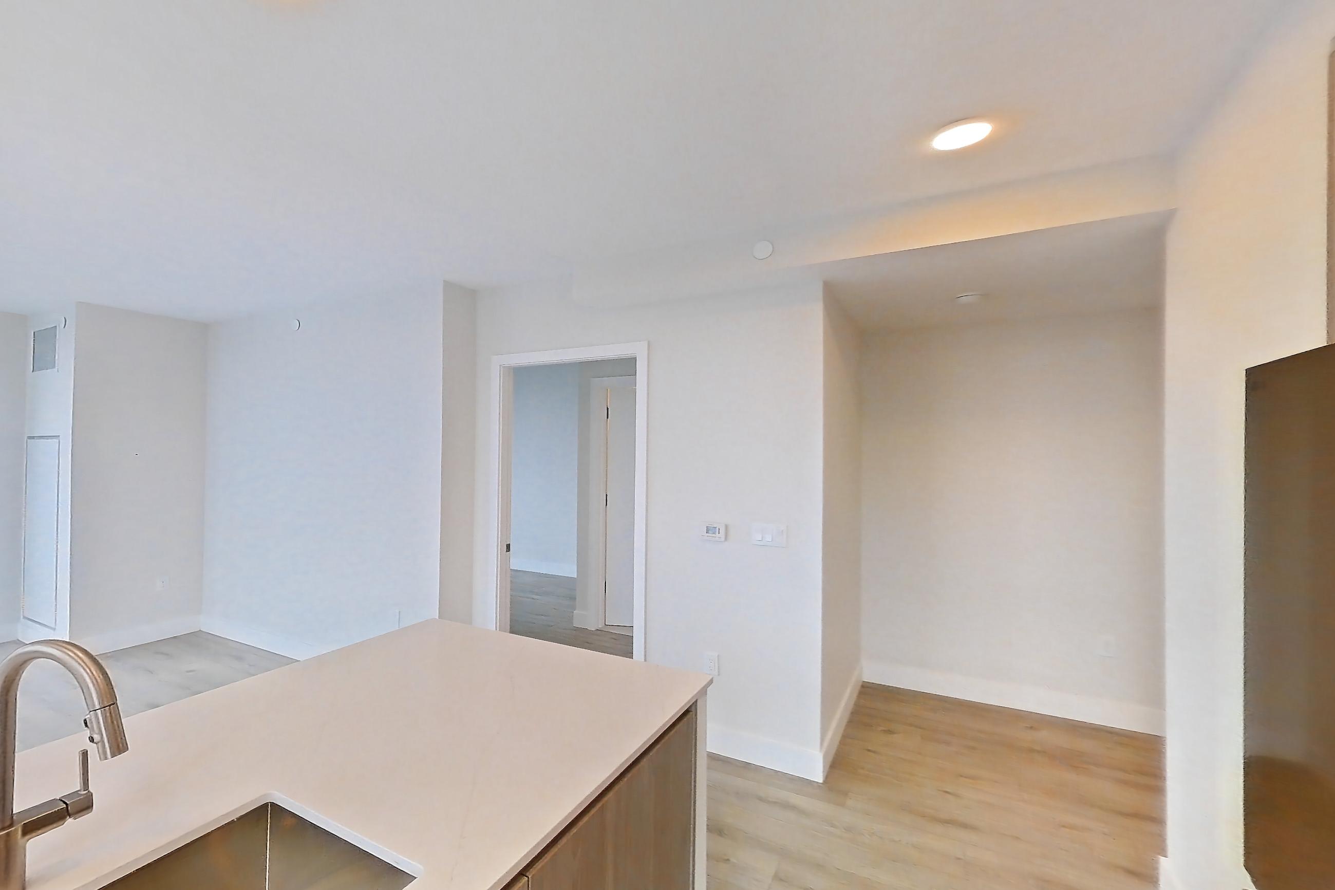 Kitchen with gas range, light wood-finish flooring, oven/range, and stainless steel appliances, Apartment 1338 at Loden