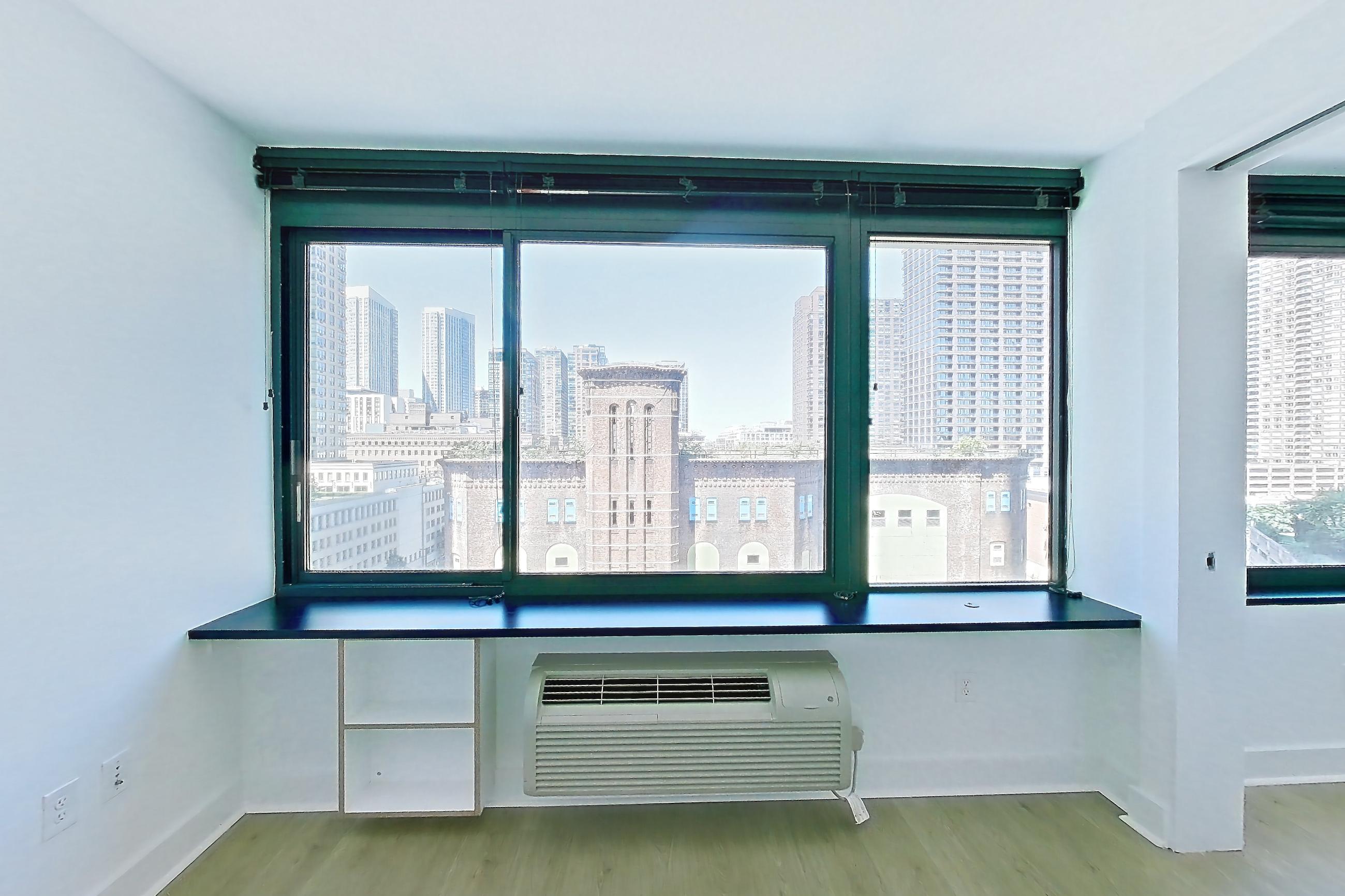 Living room with air conditioning, city view, and skyline view, Apartment SAB-1007 at Sable