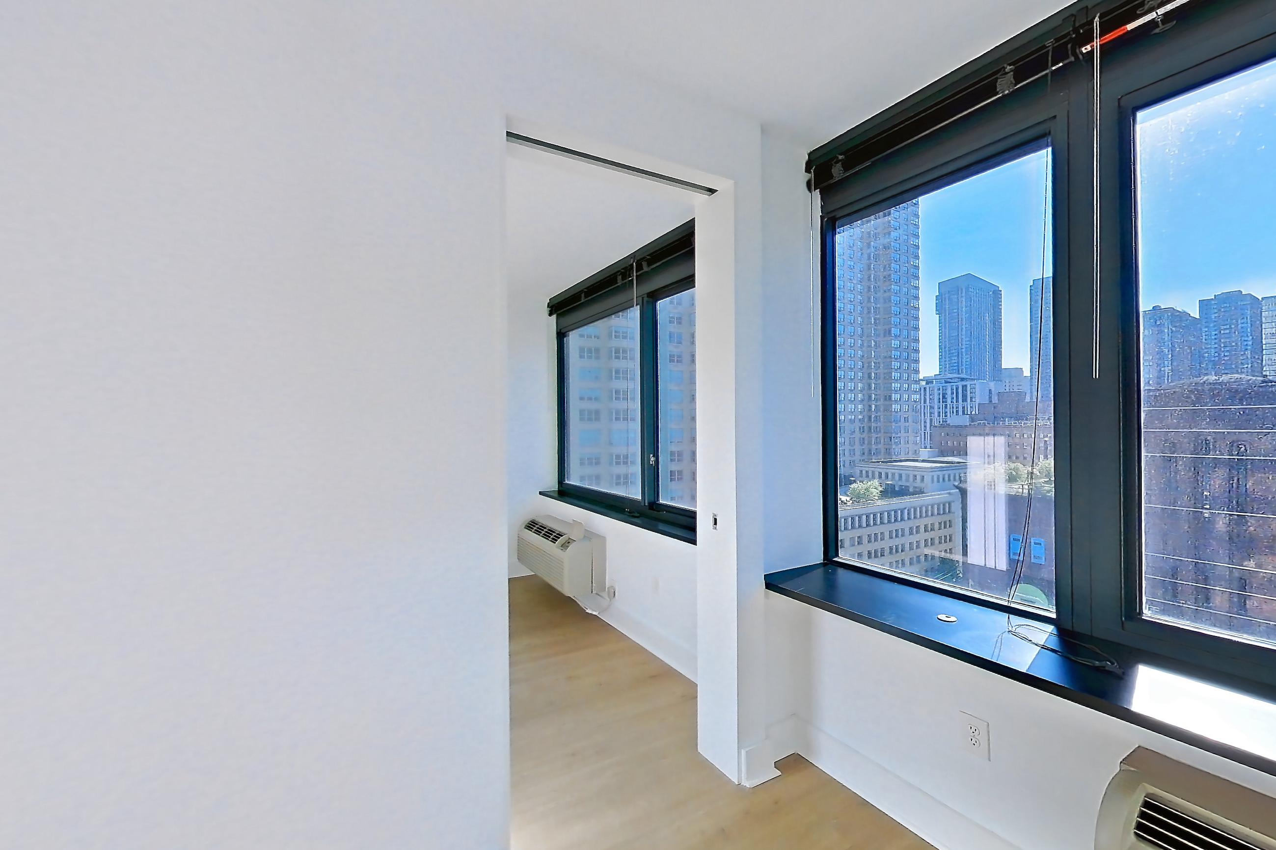 Living room with air conditioning, city view, and skyline view, Apartment SAB-1206 at Sable
