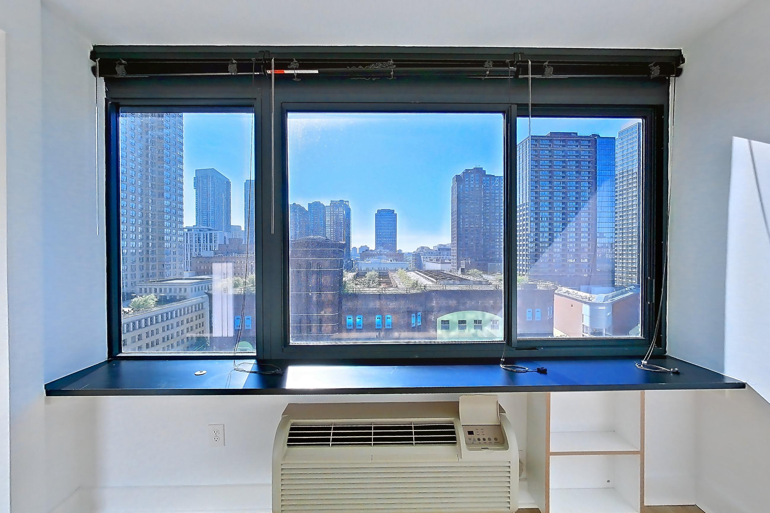 Living room with air conditioning, city view, and skyline view, Apartment SAB-1206 at Sable