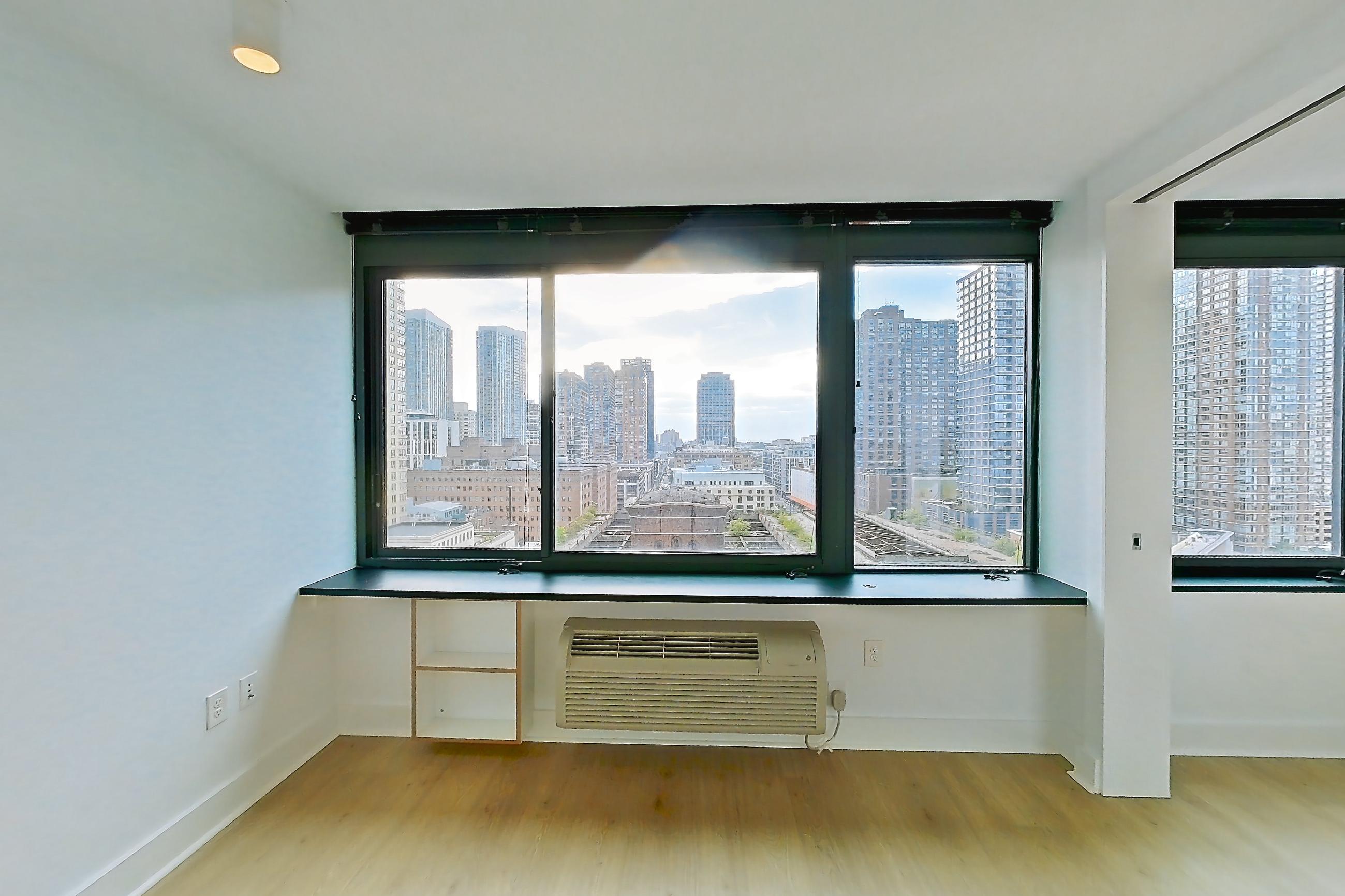 Living room with air conditioning, city view, and skyline view, Apartment SAB-1507 at Sable
