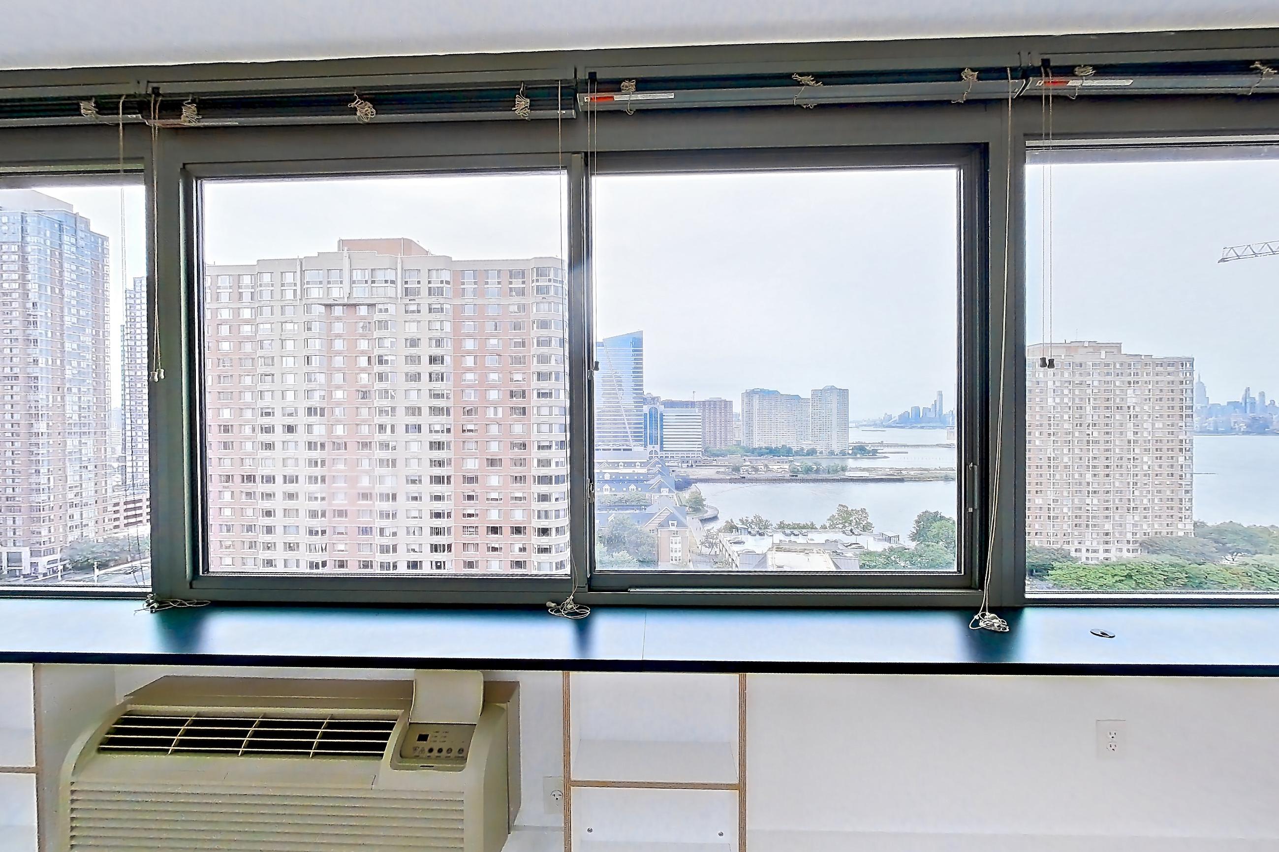 Living space with air conditioning and light wood-finish flooring, Apartment SAB-1704 at Sable
