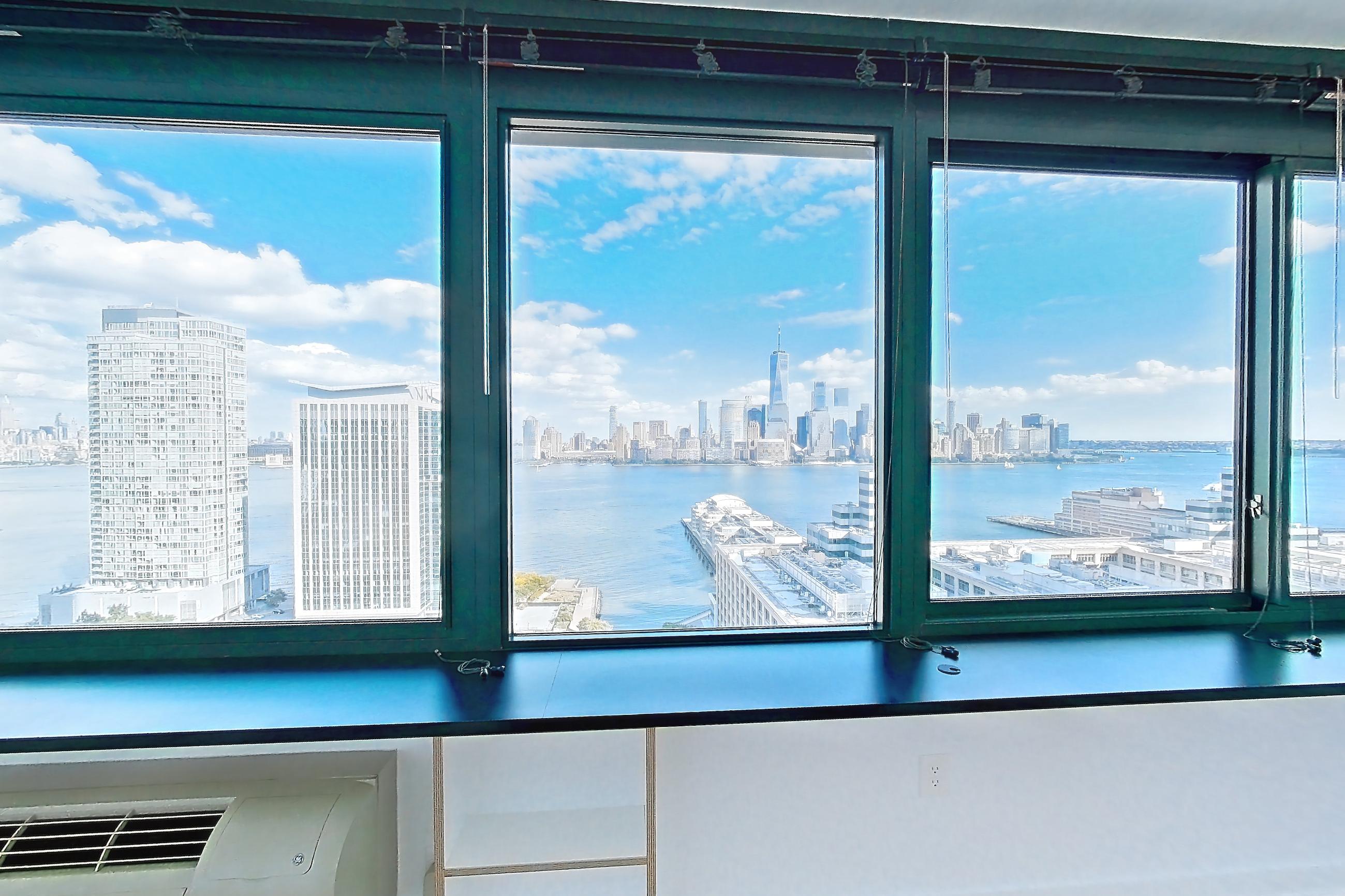 Living room with city view, skyline view, and water view, Apartment SAB-2501 at Sable