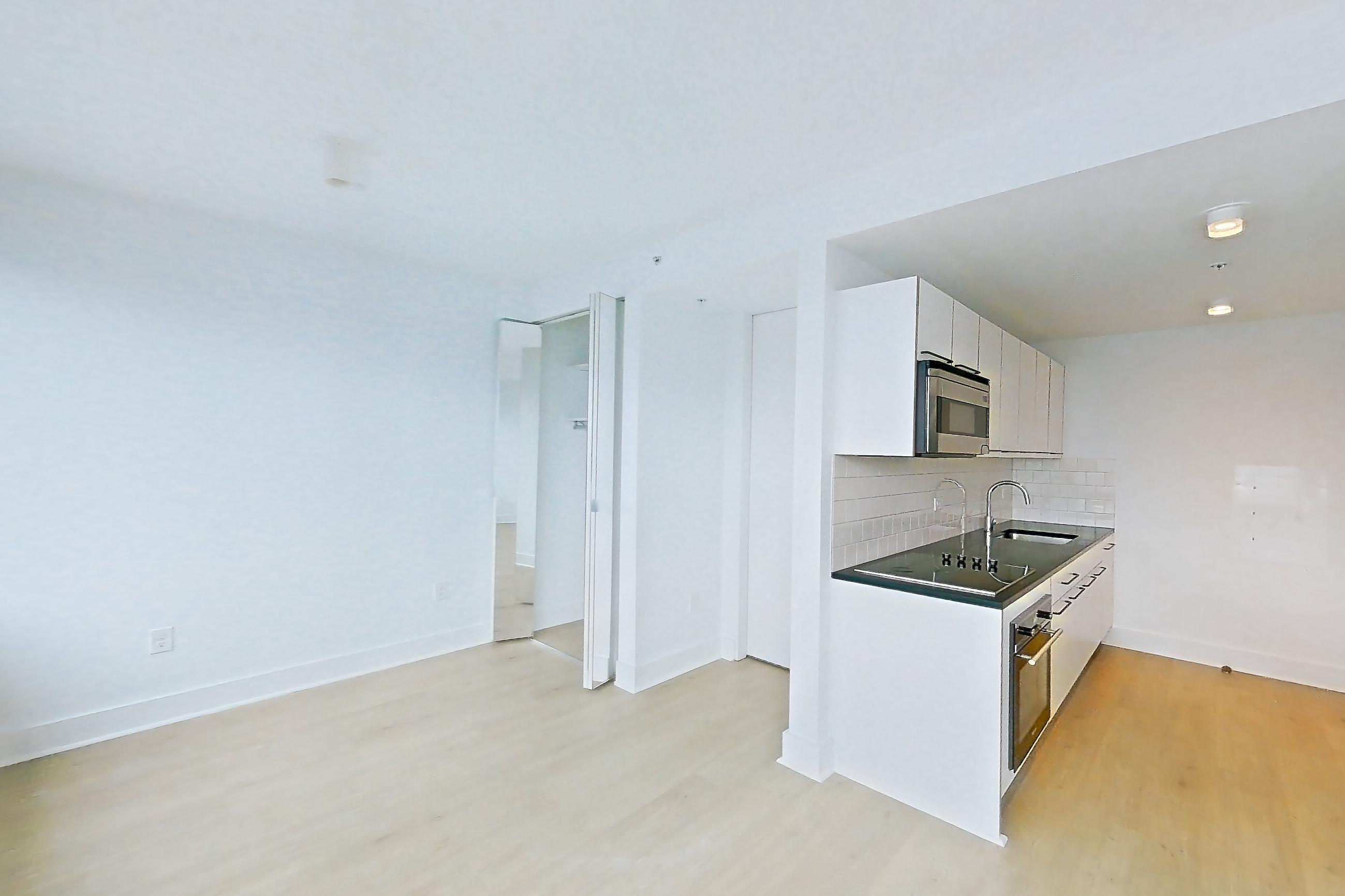Living space with light wood-finish flooring, skyline view, and water view, Apartment SAB-3101 at Sable