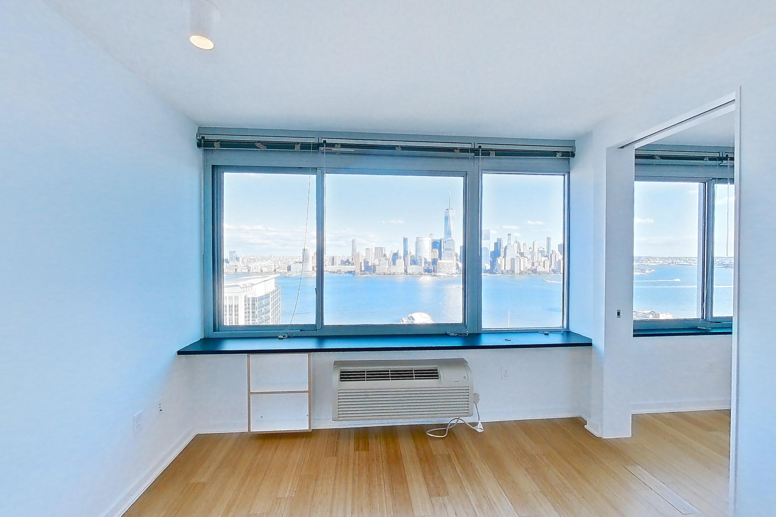 Living room with city view, light wood-finish flooring, and skyline view, Apartment SAB-3801 at Sable