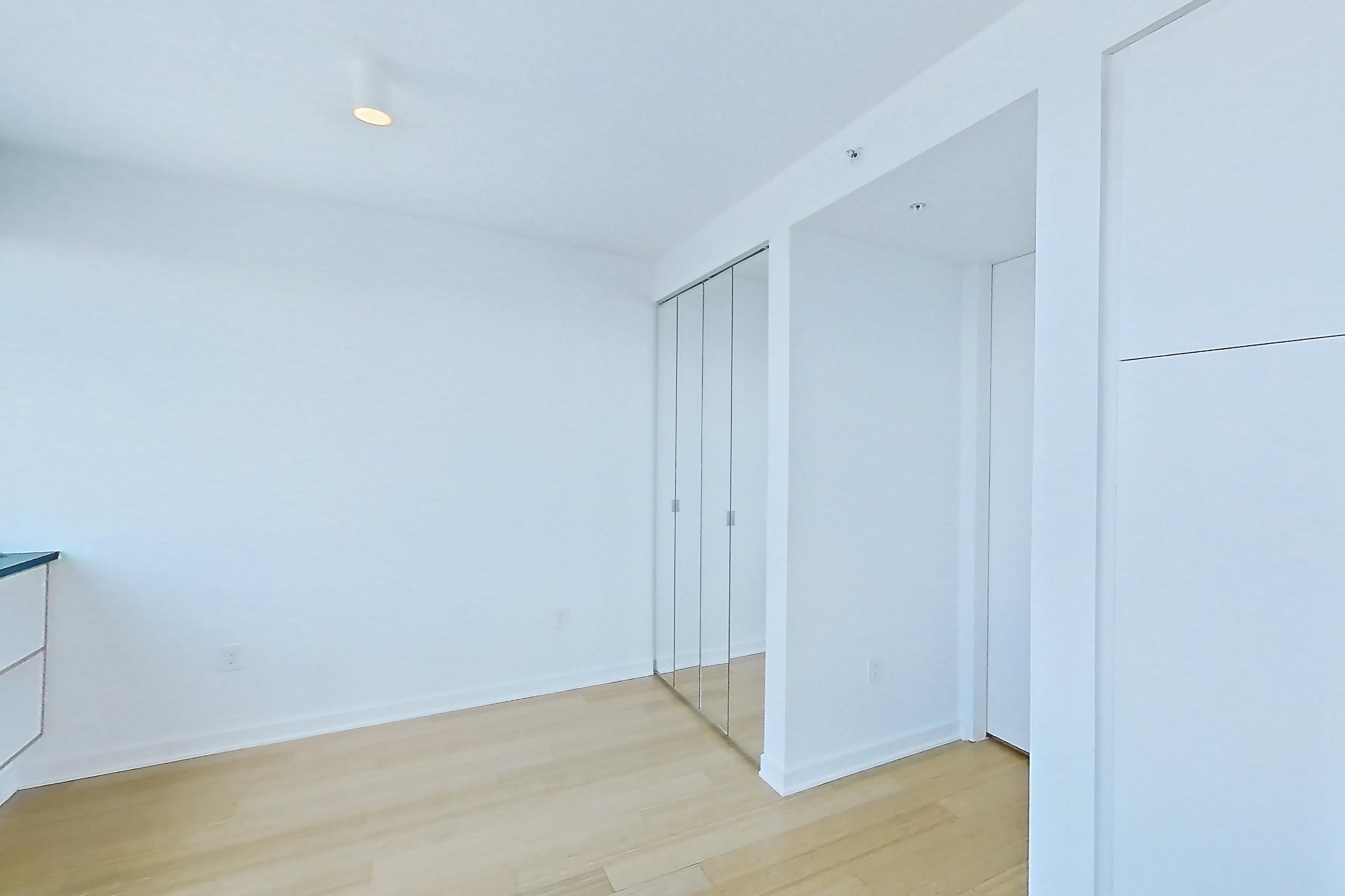 Living room with city view and light wood-finish flooring, Apartment SAB-5807 at Sable