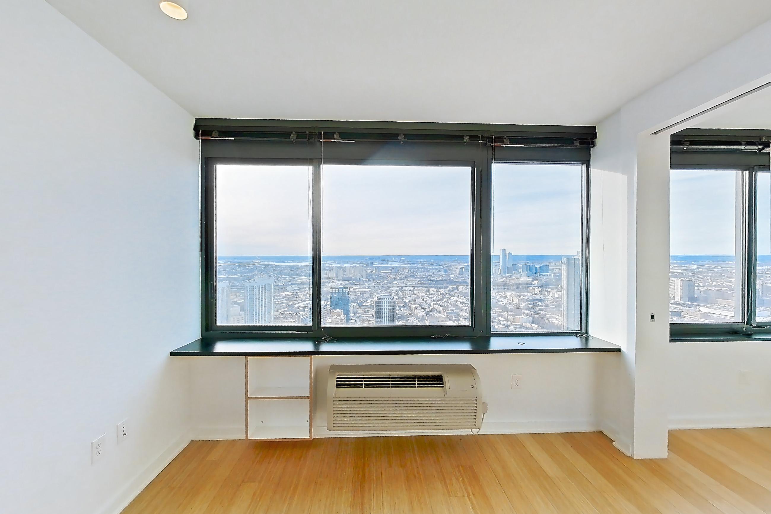 Living room with light wood-finish flooring and wood-finish flooring, Apartment SAB-6807 at Sable