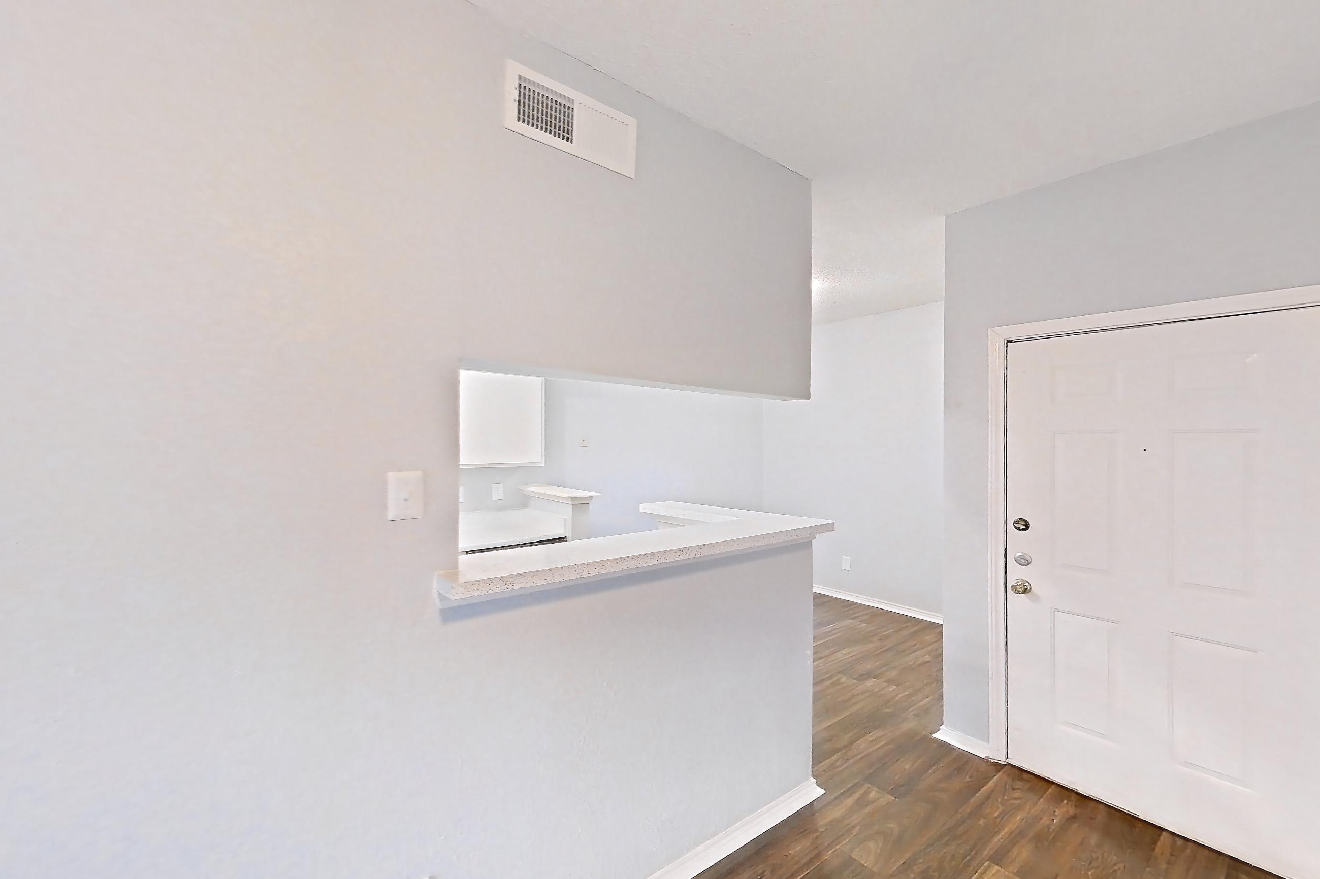 Living room with dark wood-finish flooring, Apartment 209 at The Griffin Apartments