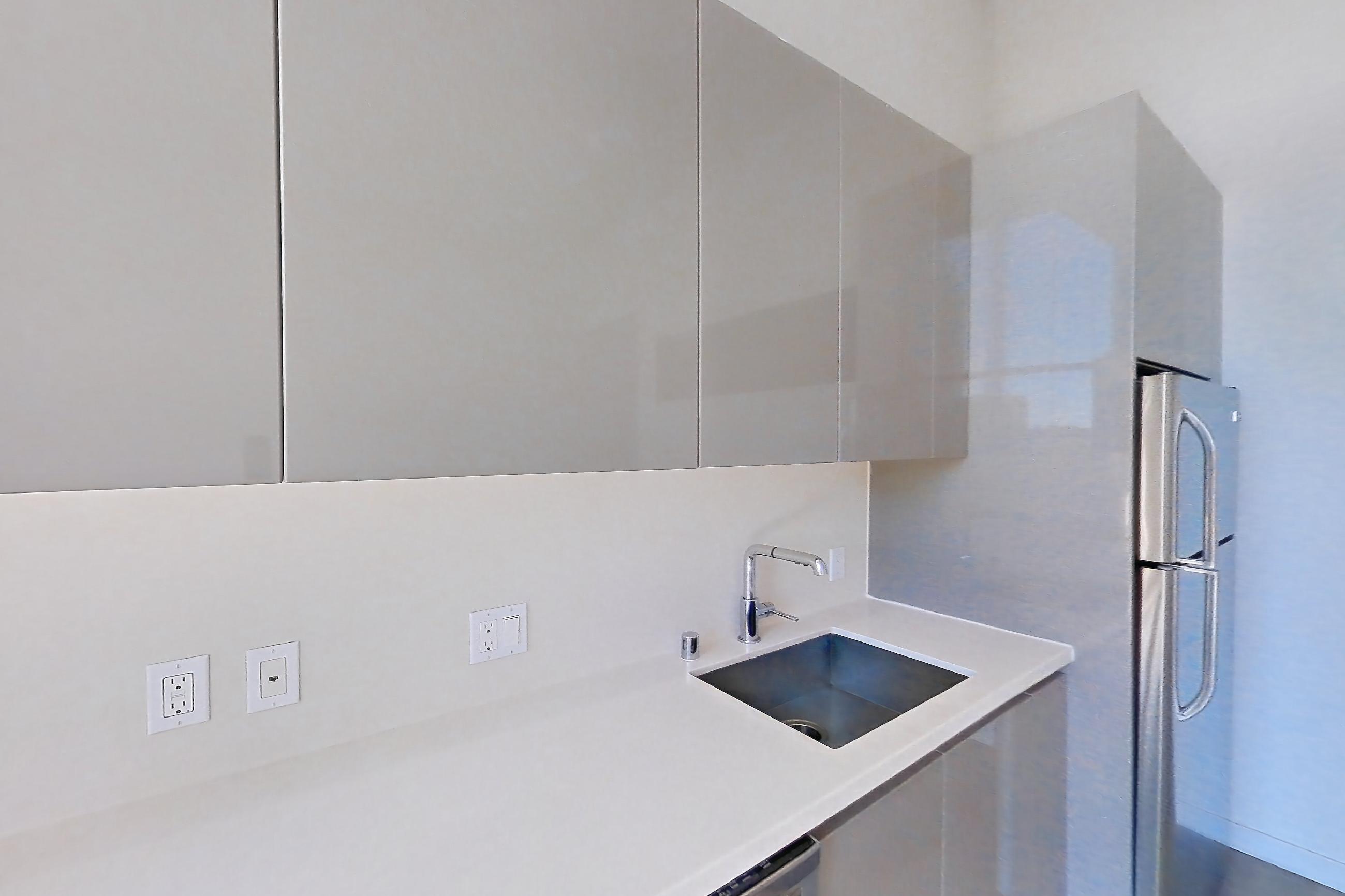 Kitchen in Apartment 0-7167 at Eighth and Grand, Jr 1A floor plan