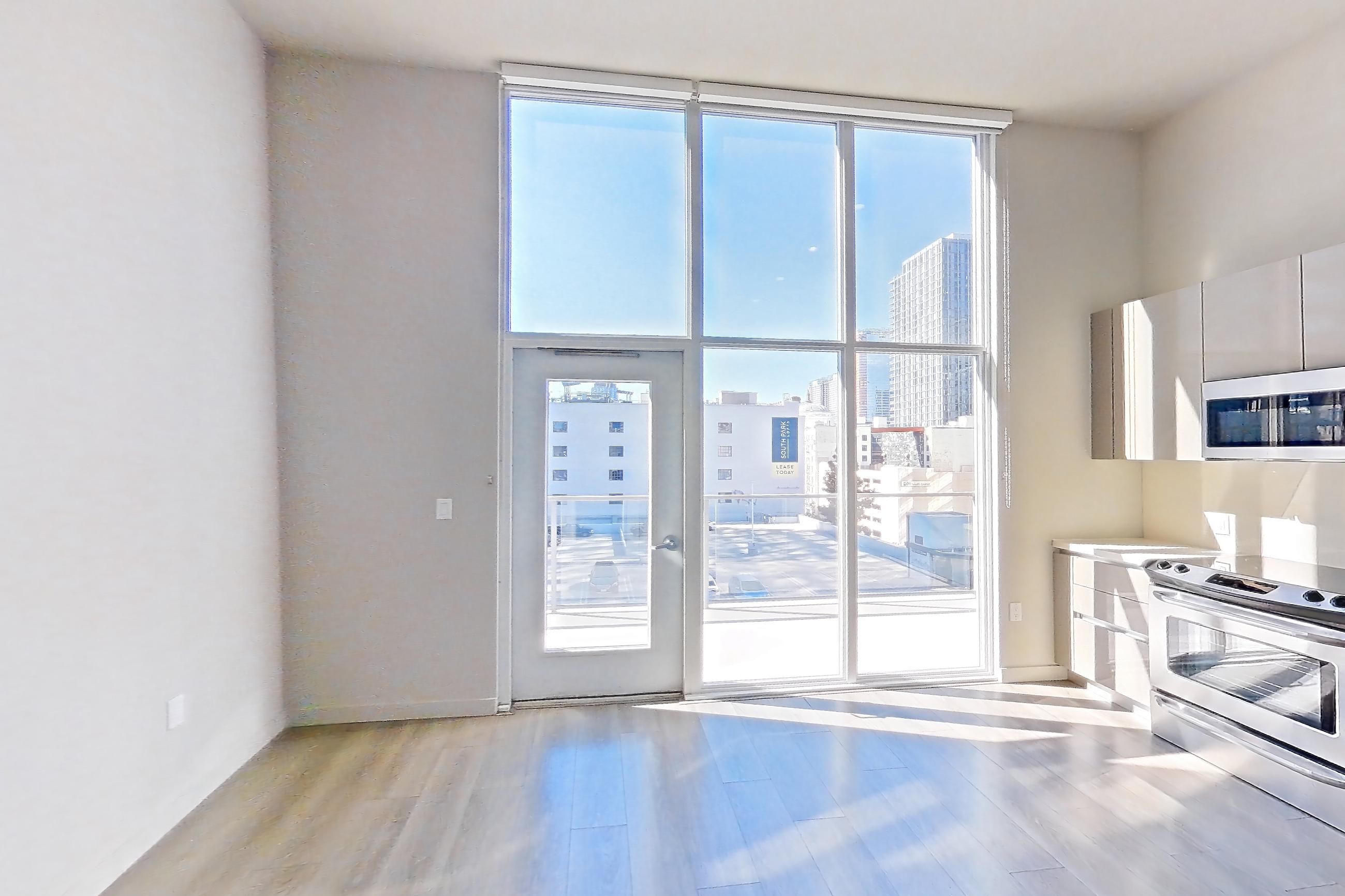 Living room in Apartment 0-7167 at Eighth and Grand, Jr 1A floor plan