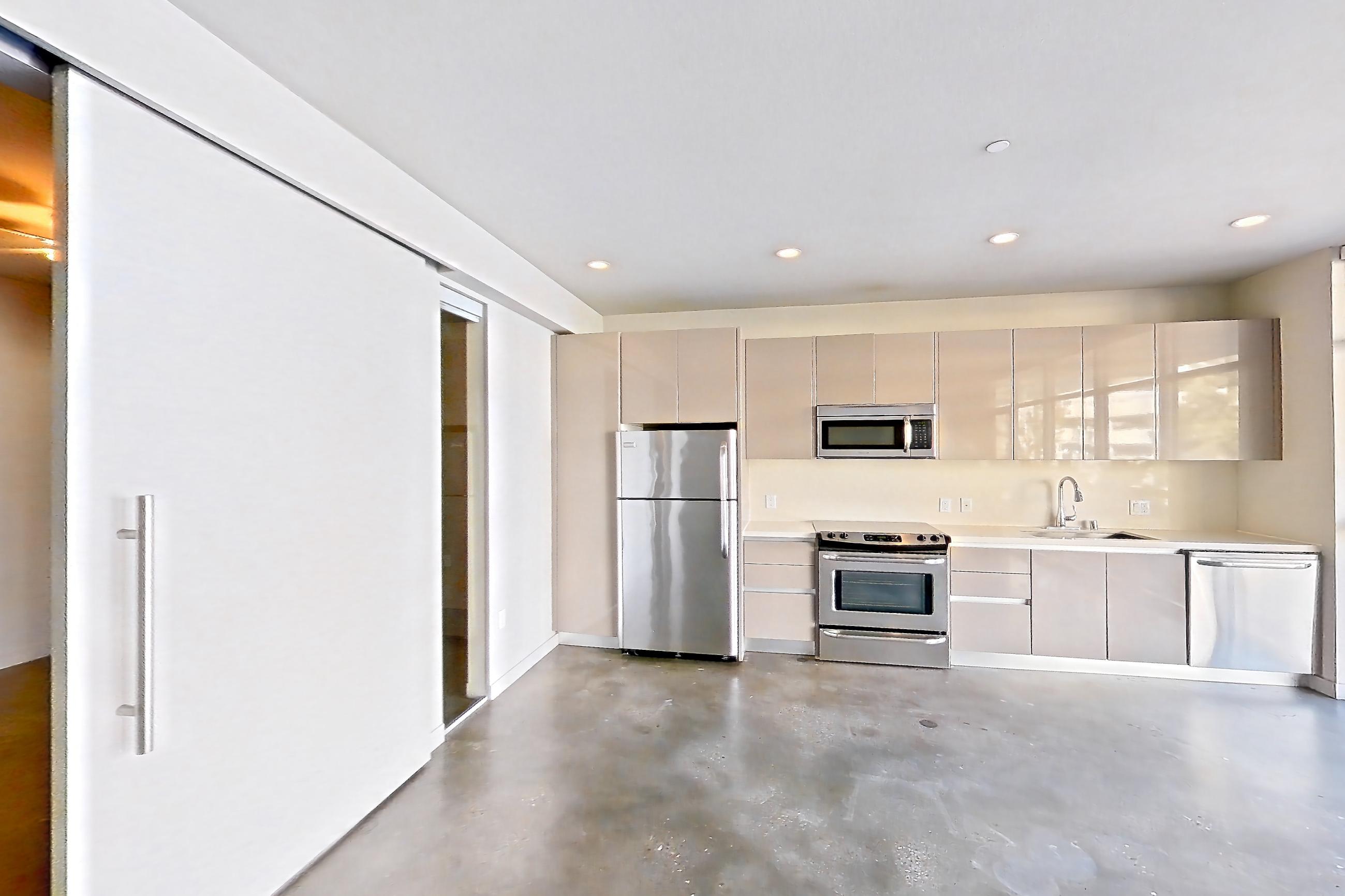 Living room in Apartment 0-2003 at Eighth and Grand, Jr 1R floor plan