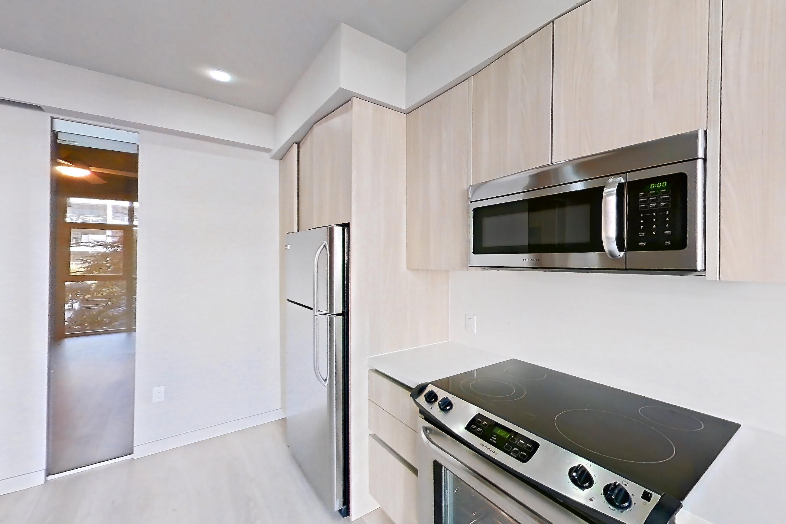 Kitchen in Apartment 0-3136 at Eighth and Grand, Jr 1U floor plan