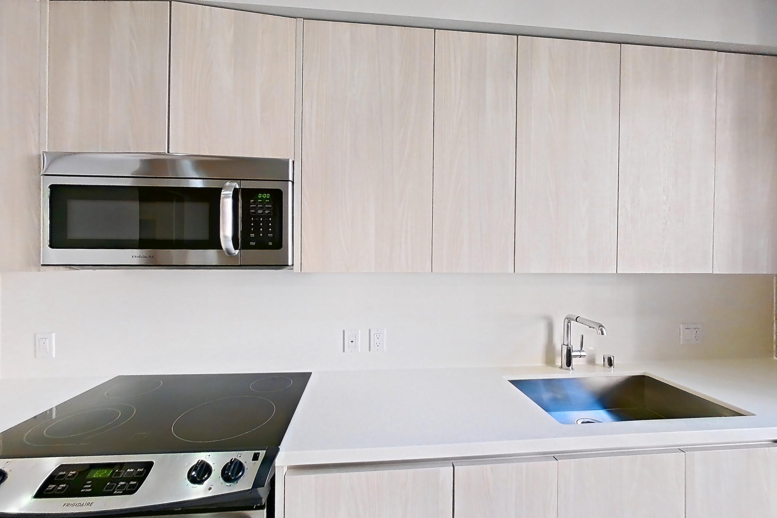Kitchen in Apartment 0-3136 at Eighth and Grand, Jr 1U floor plan