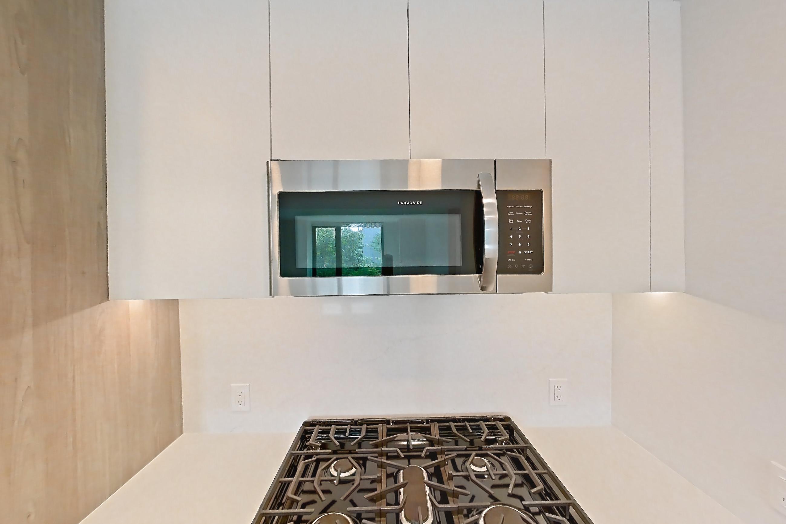 Kitchen with gas range, oven/range, and stainless steel appliances, Apartment 324 at Loden
