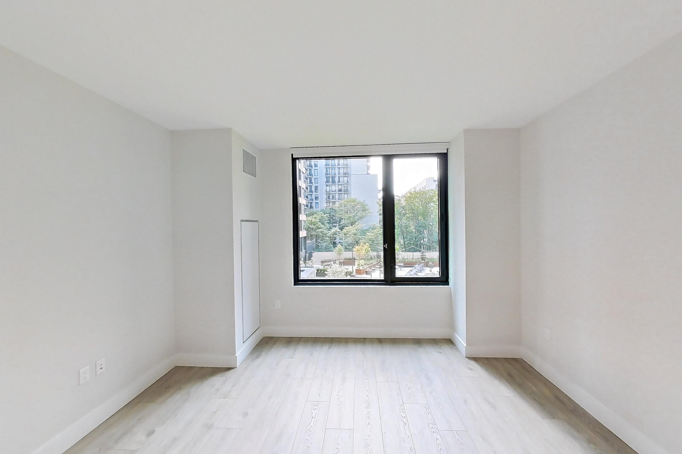 Living room with light wood-finish flooring, Apartment 324 at Loden
