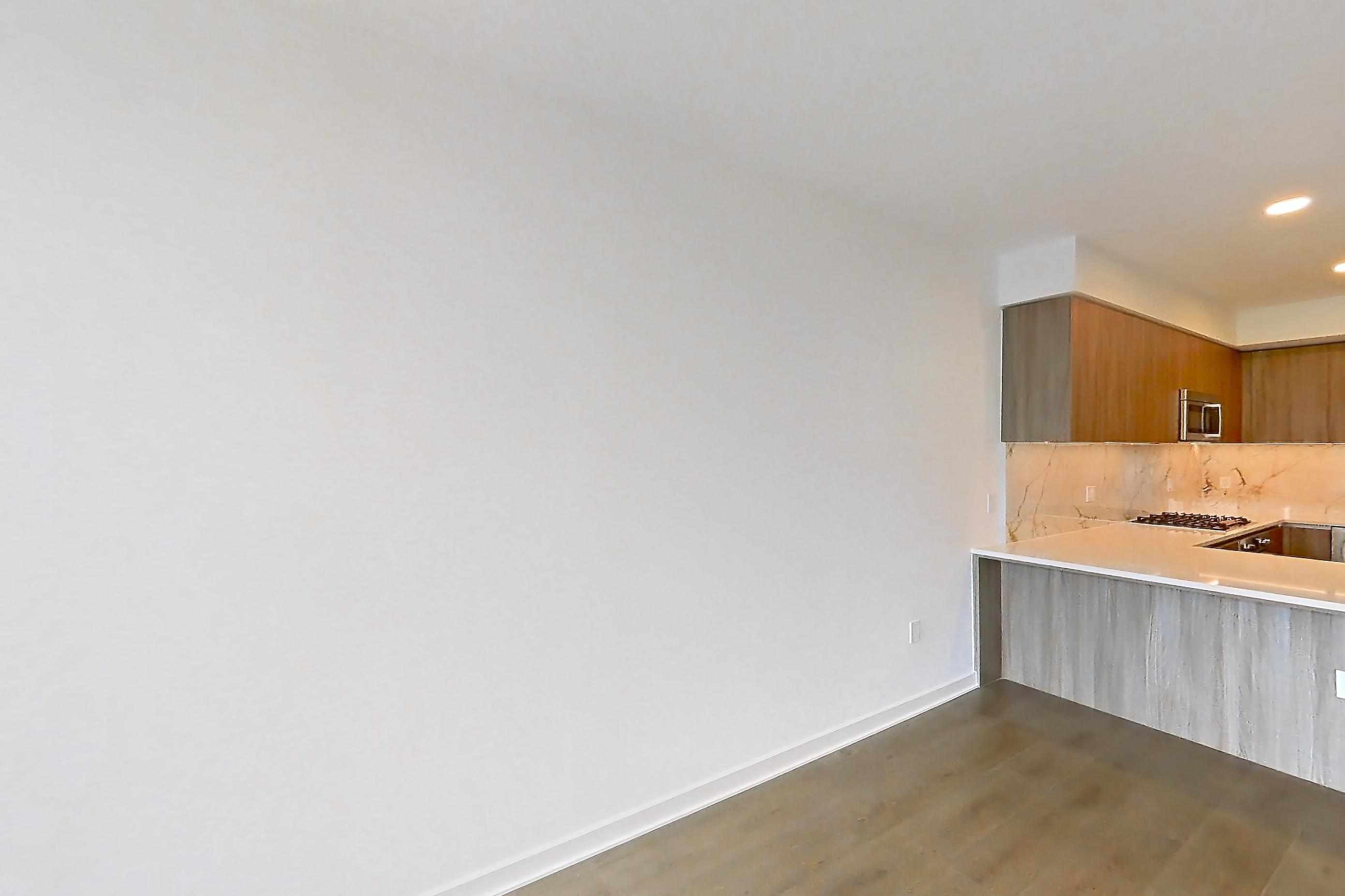 Living room with light wood-finish flooring, Apartment 0306 at Aerie