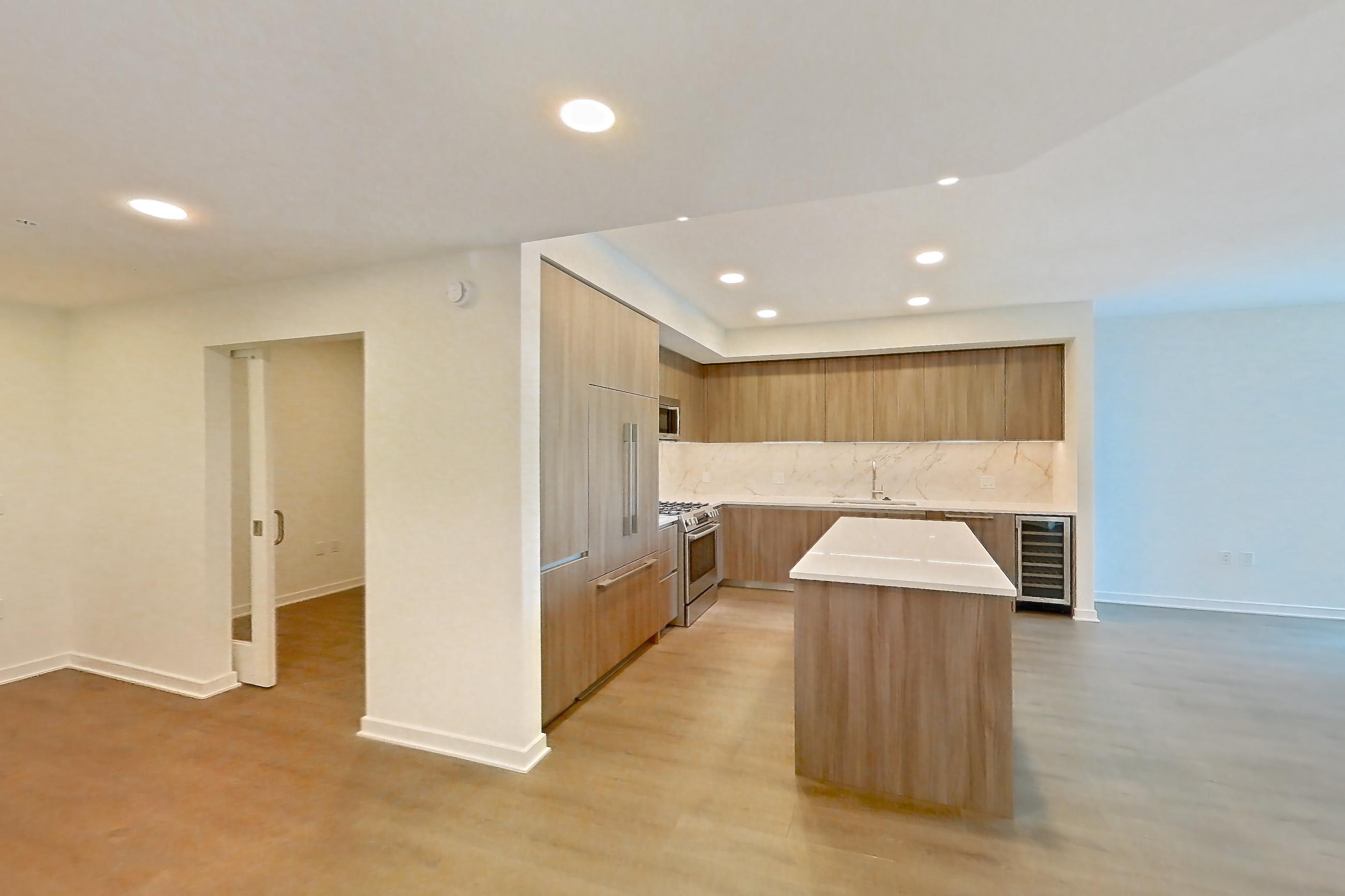 Dining room with gas range, light wood-finish flooring, oven/range, and stainless steel appliances, Apartment 0310 at Aerie