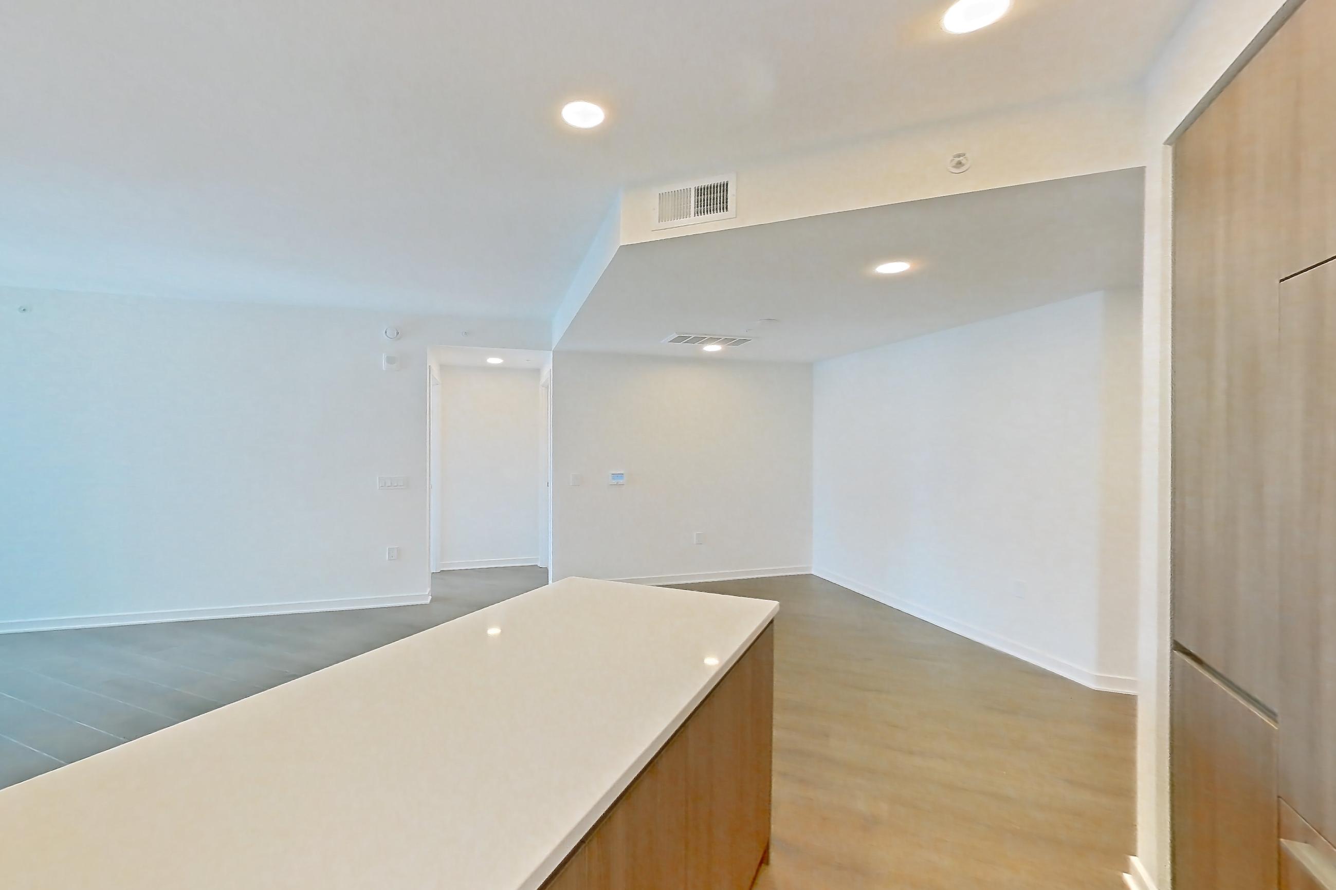 Kitchen with light wood-finish flooring, Apartment 0310 at Aerie