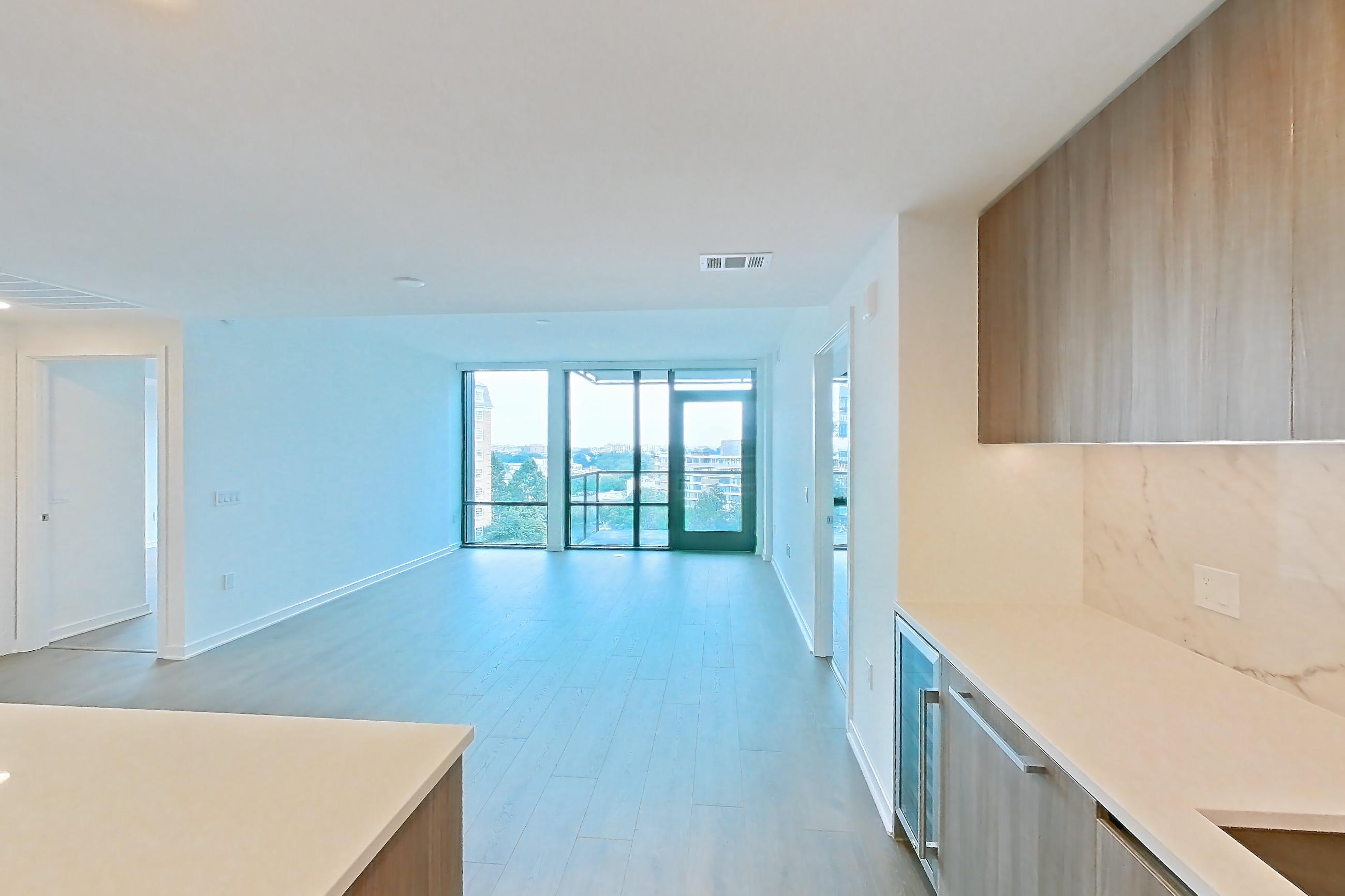 Kitchen with gas range, light stone countertops, light wood-finish flooring, oven/range, and stainless steel appliances, Apartment 0619 at Aerie