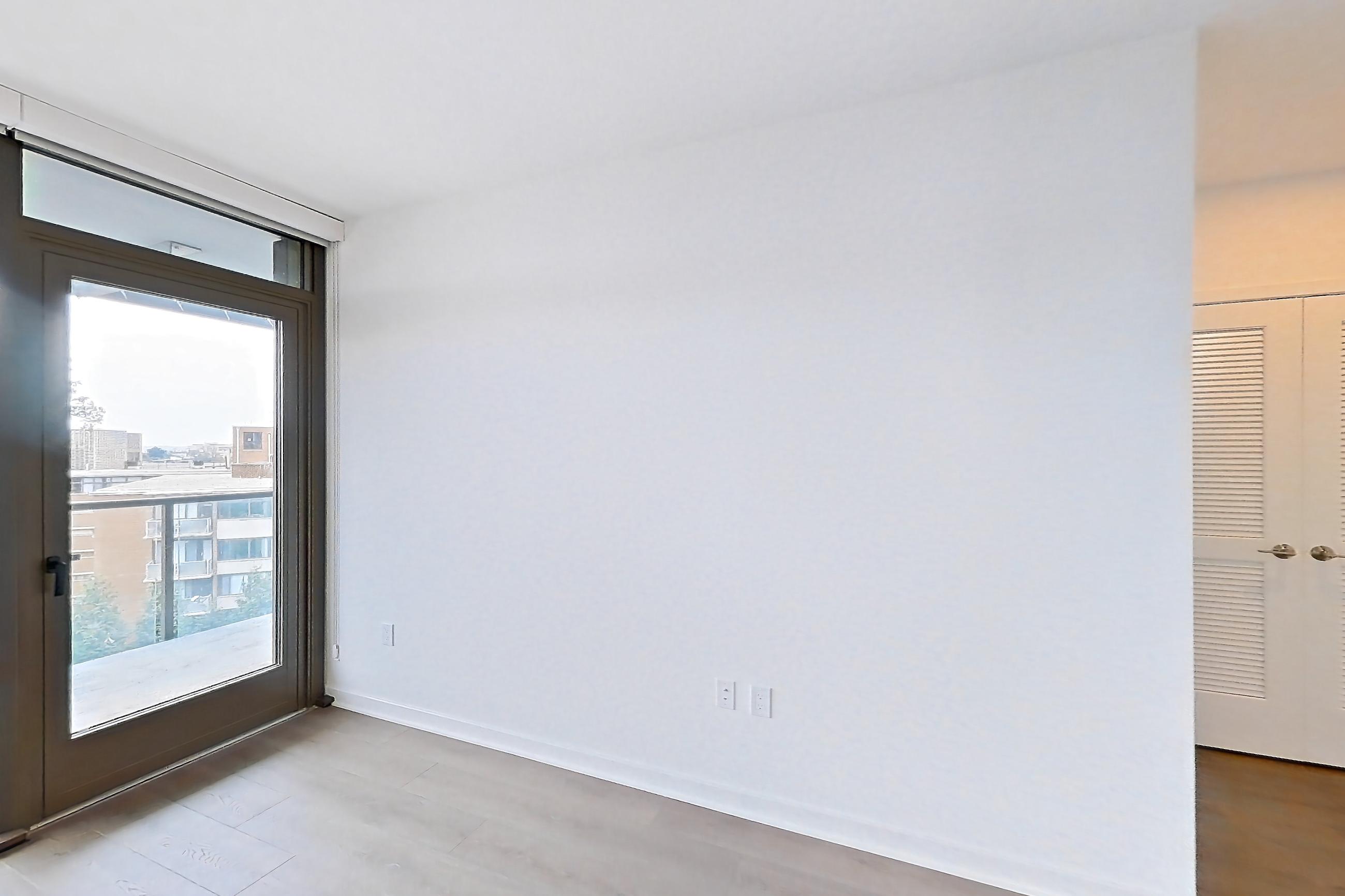 Living room with light wood-finish flooring, Apartment 0613 at Aerie