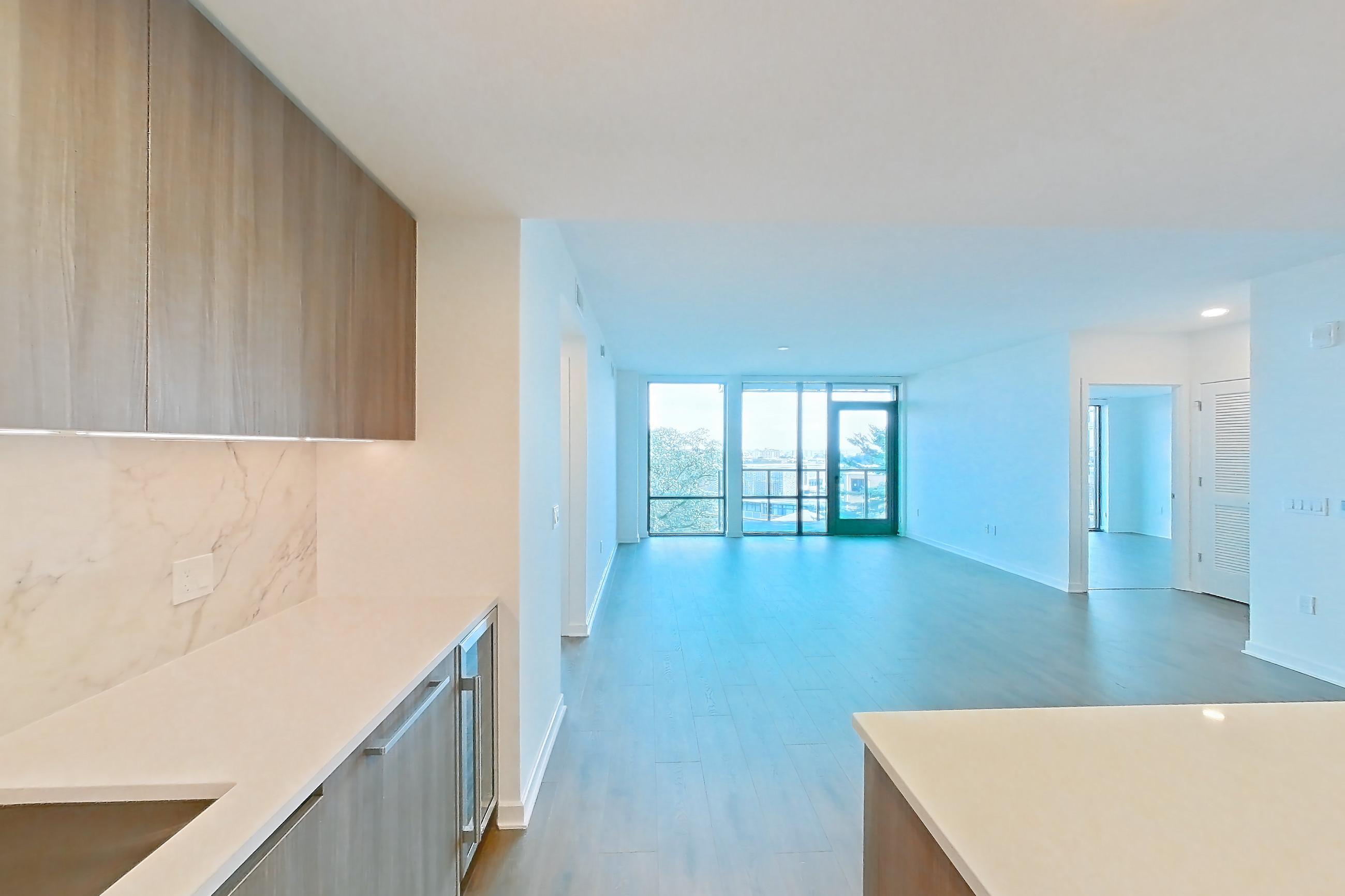 Kitchen with gas range, light stone countertops, light wood-finish flooring, oven/range, and stainless steel appliances, Apartment 0812 at Aerie