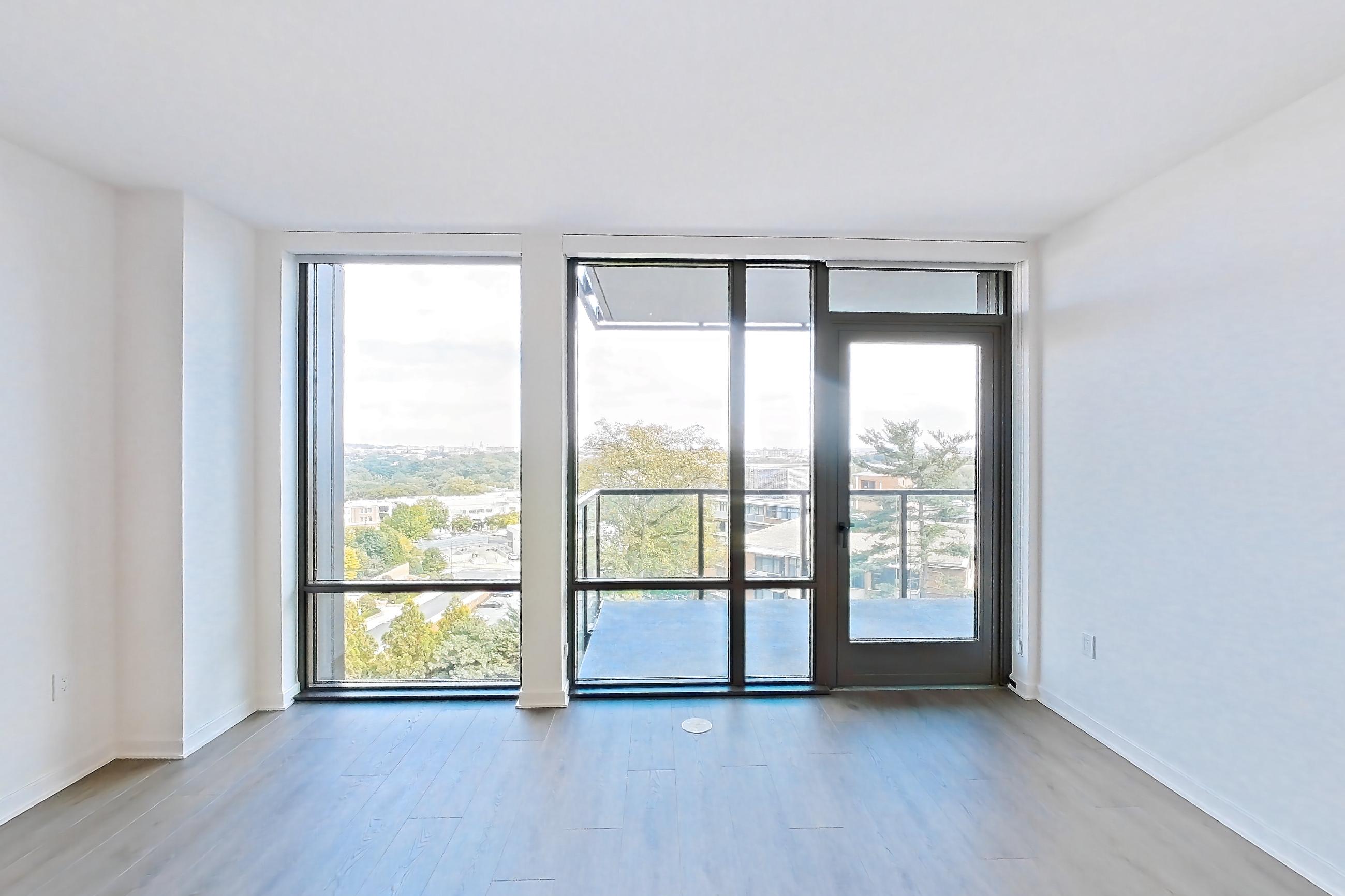 Living room with dark wood-finish flooring and light wood-finish flooring, Apartment 0812 at Aerie