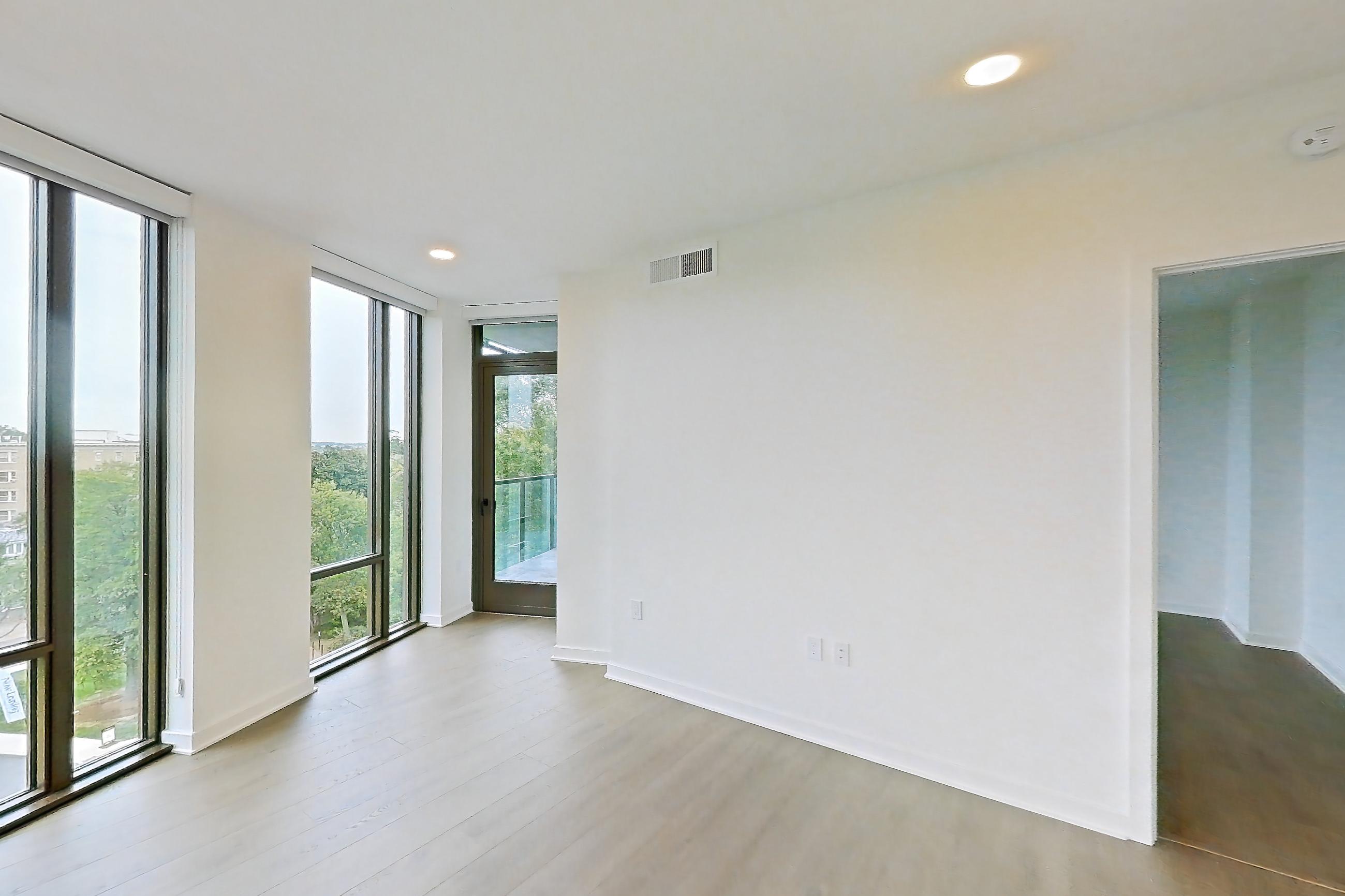 Living room with light wood-finish flooring, Apartment 0622 at Aerie