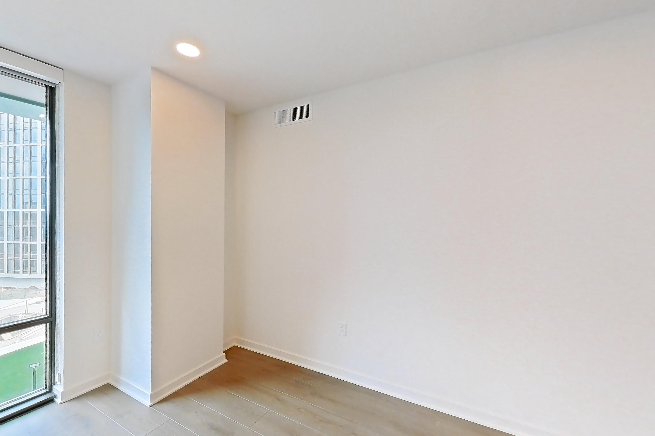 Living room with light wood-finish flooring, Apartment 0331 at Aerie