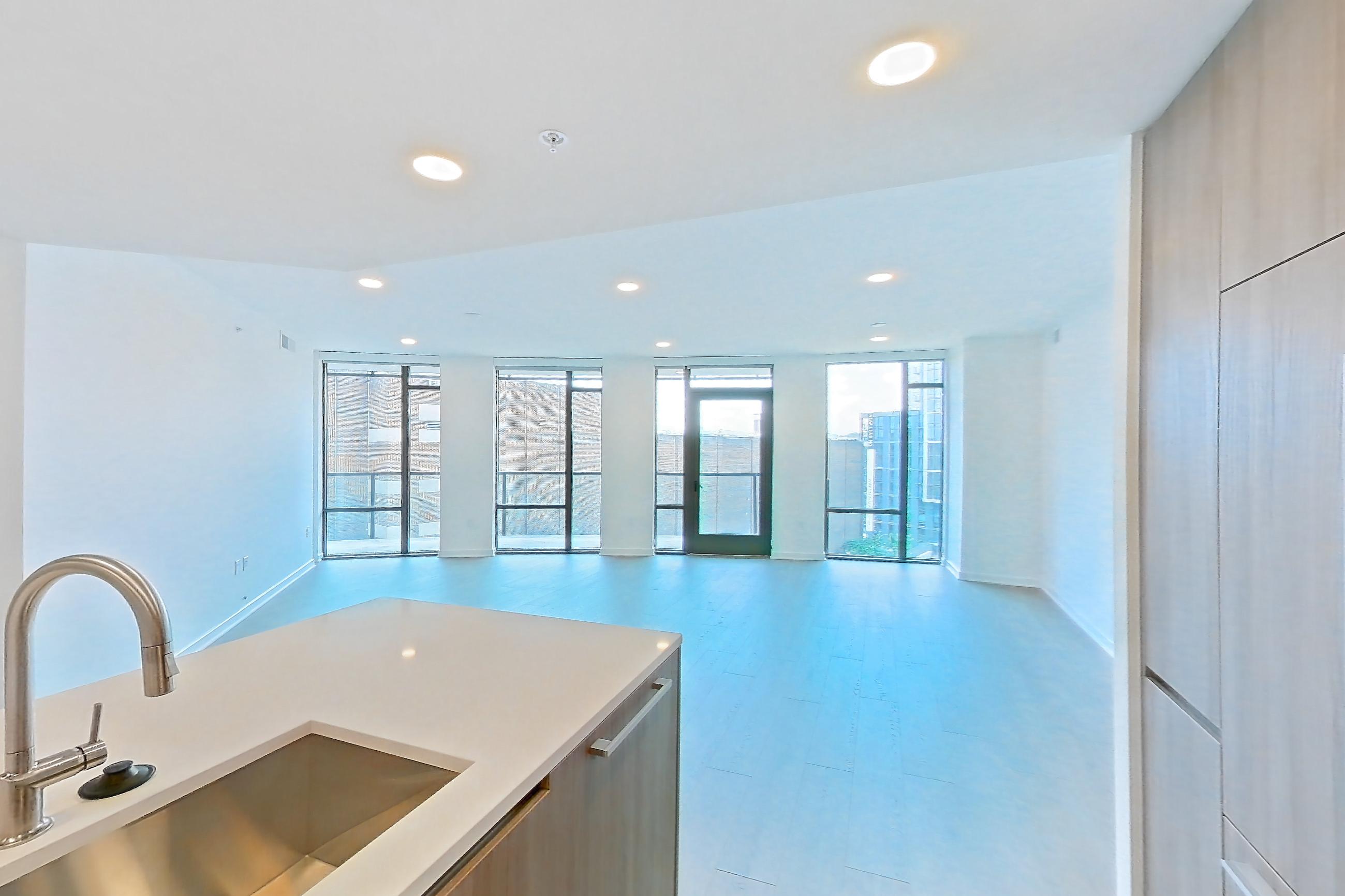 Kitchen with light wood-finish flooring, Apartment 0304 at Aerie