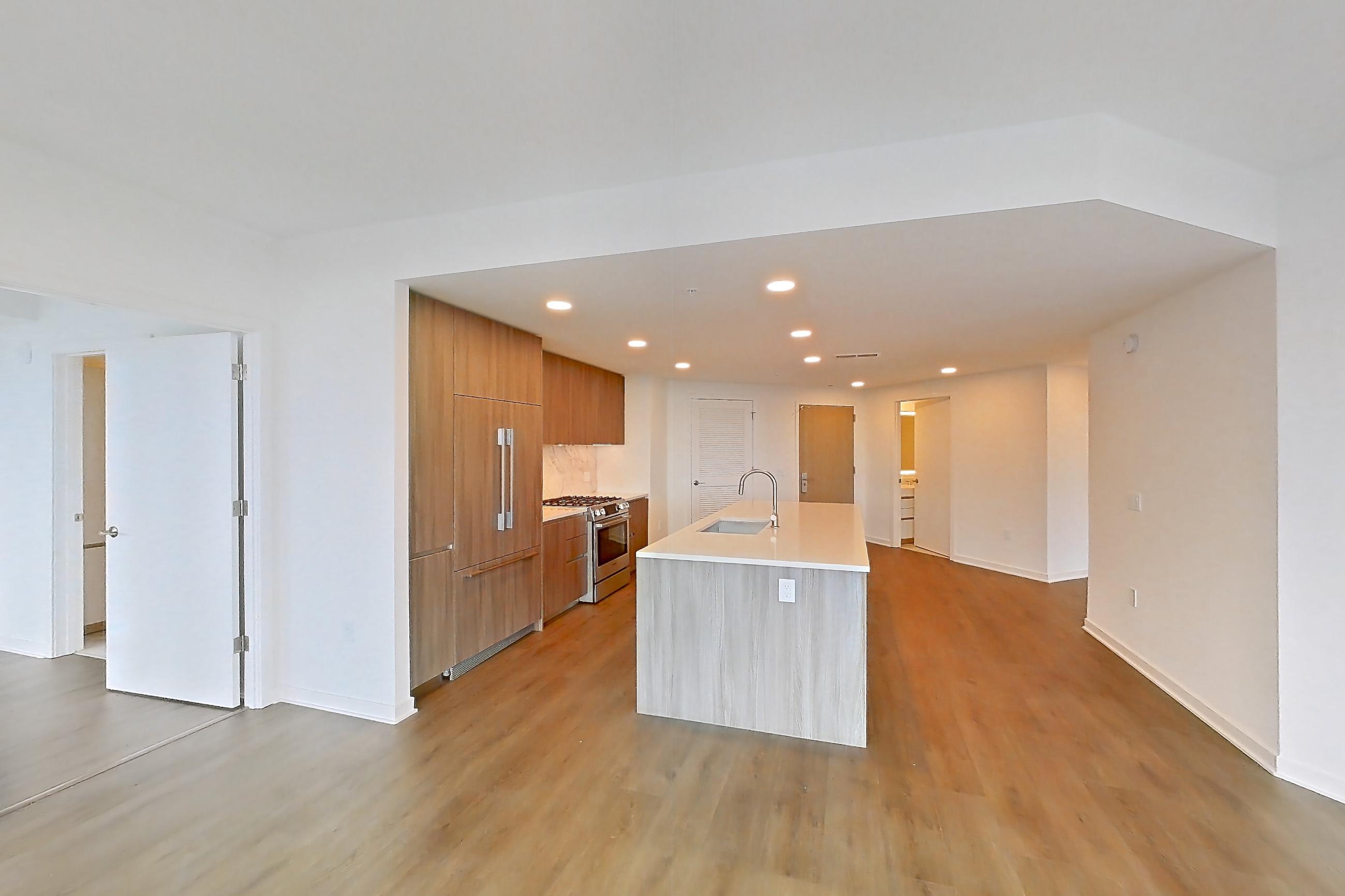 Living room with city view, light wood-finish flooring, and wood-finish flooring, Apartment 0804 at Aerie