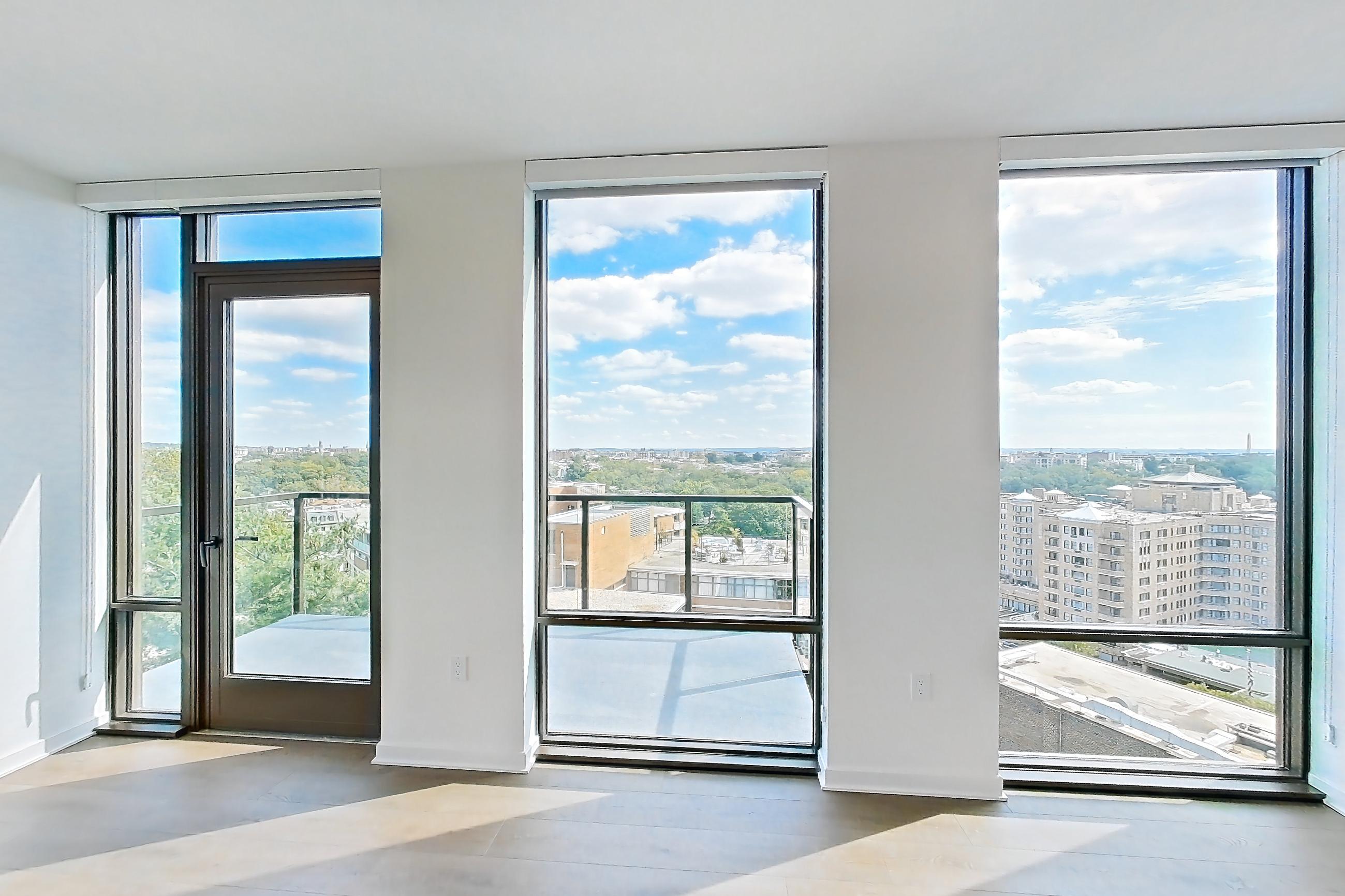 Living room with light wood-finish flooring and wood-finish flooring, Apartment 0908 at Aerie