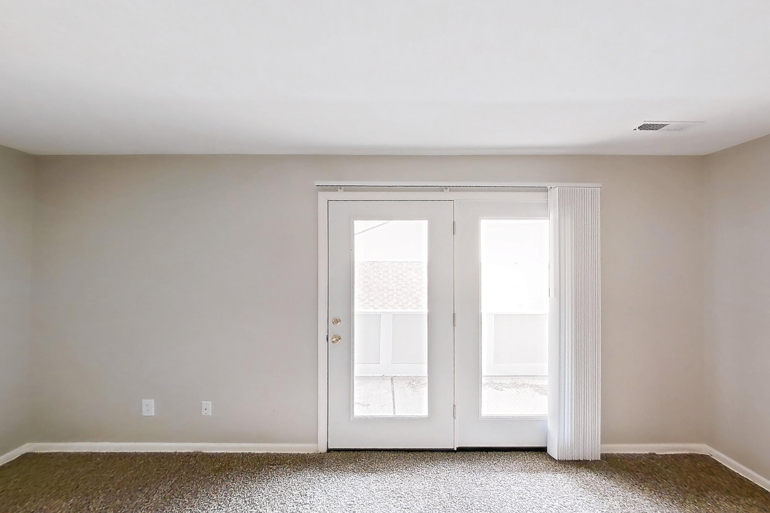 Living room with dark carpet, Apartment 2611-7AB at Canterbury Green