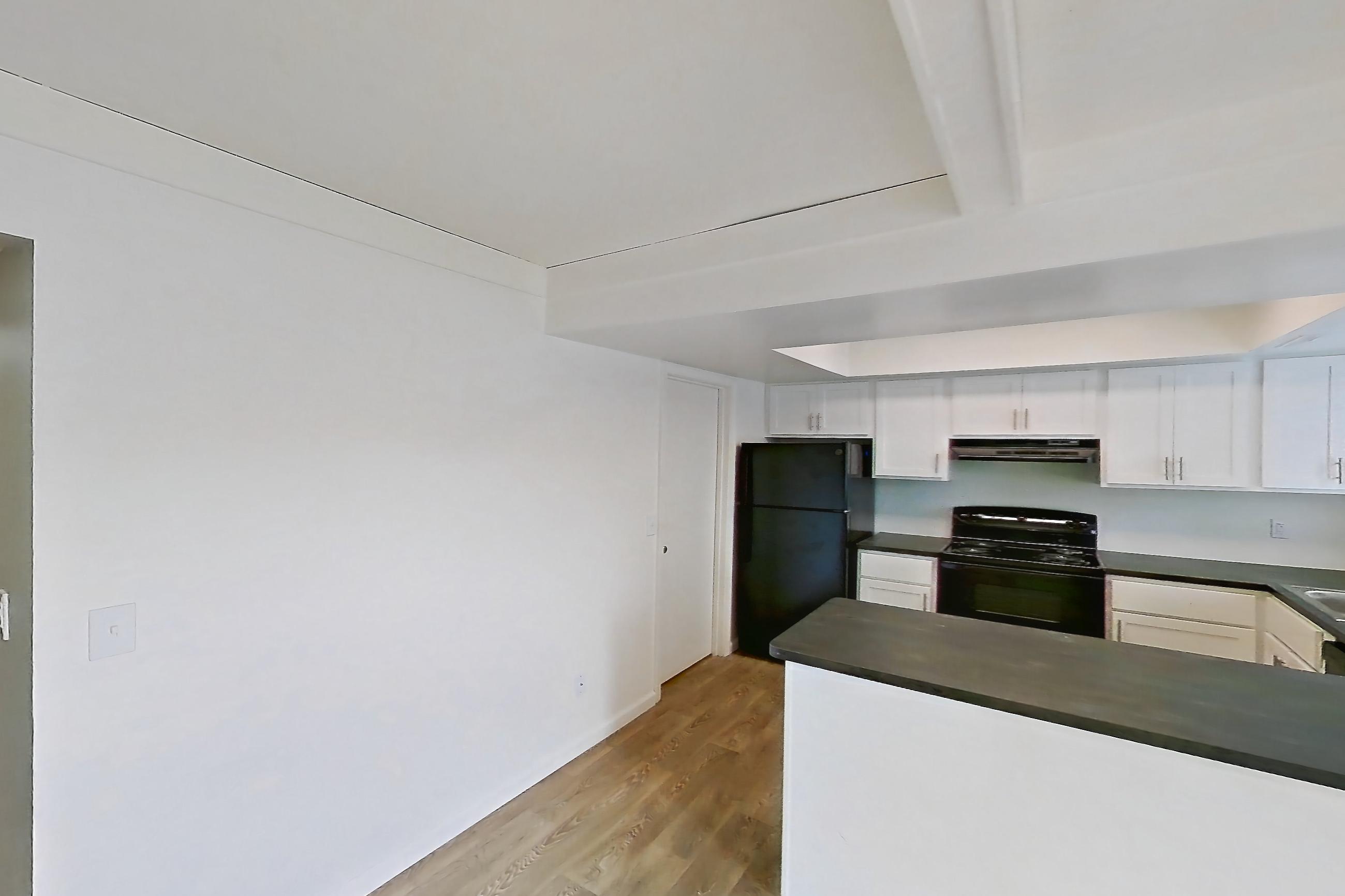 Dining room with black appliances, dark countertops, electric range, oven/range, and refrigerator, Apartment 2924CA at Canterbury Green