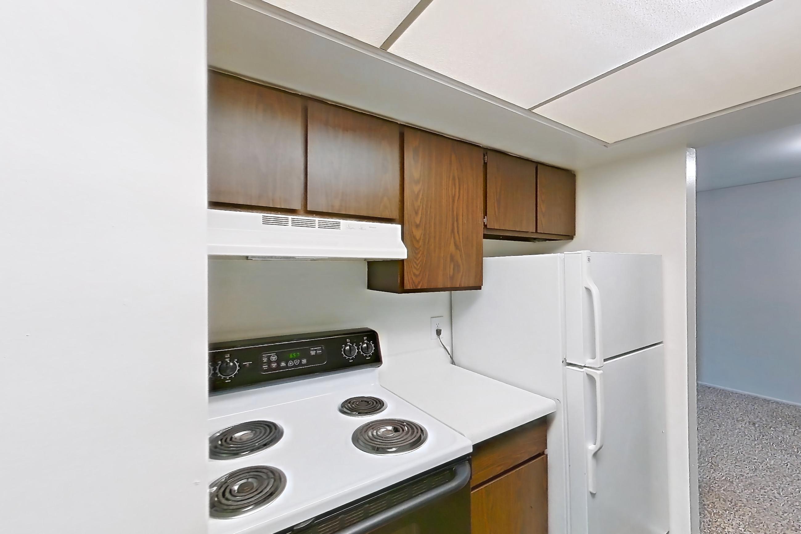 Kitchen closet with light countertops and oven/range, Apartment 2803-8NO at Canterbury Green