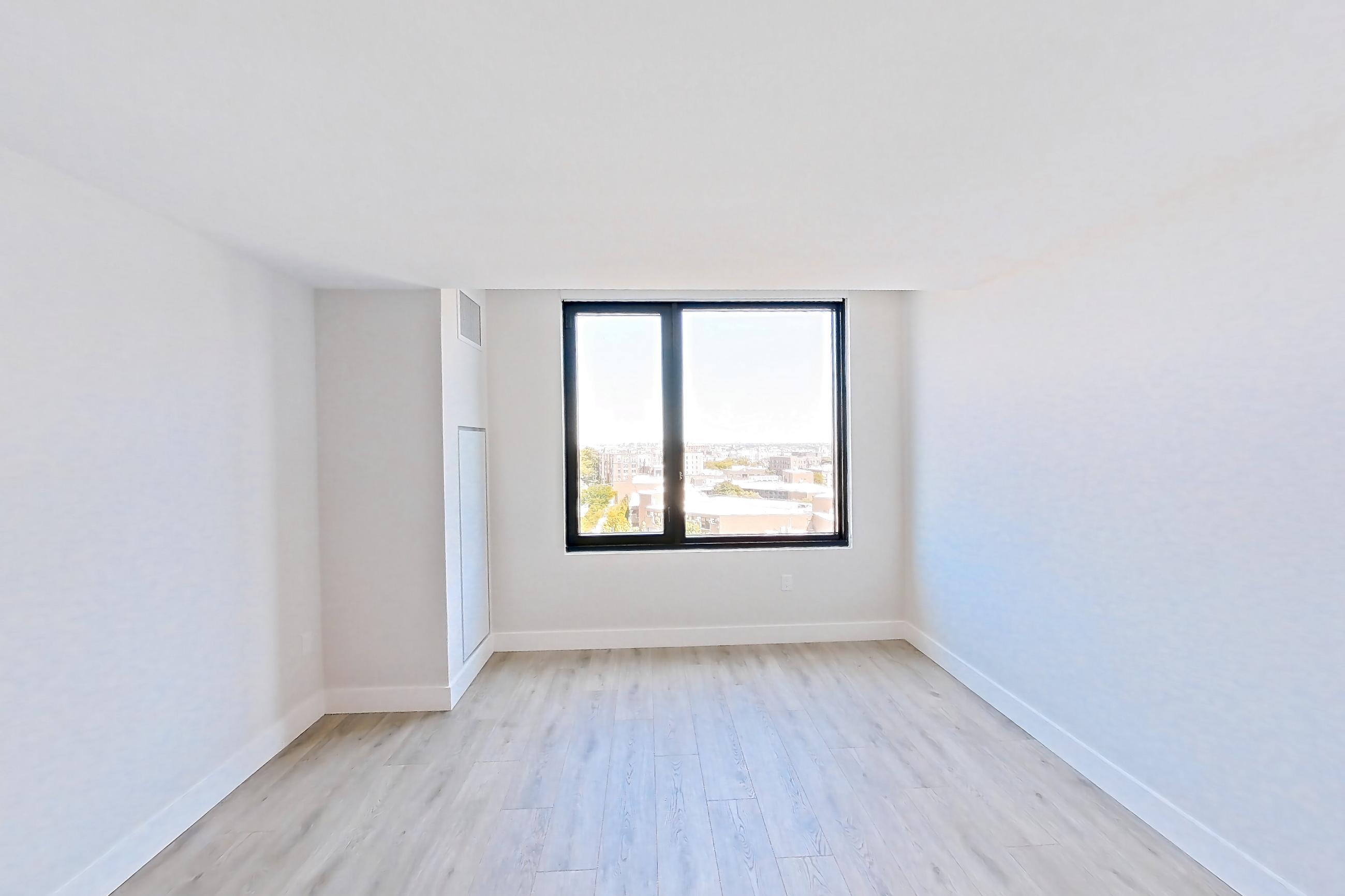 Living room with light wood-finish flooring, Apartment 917 at Loden