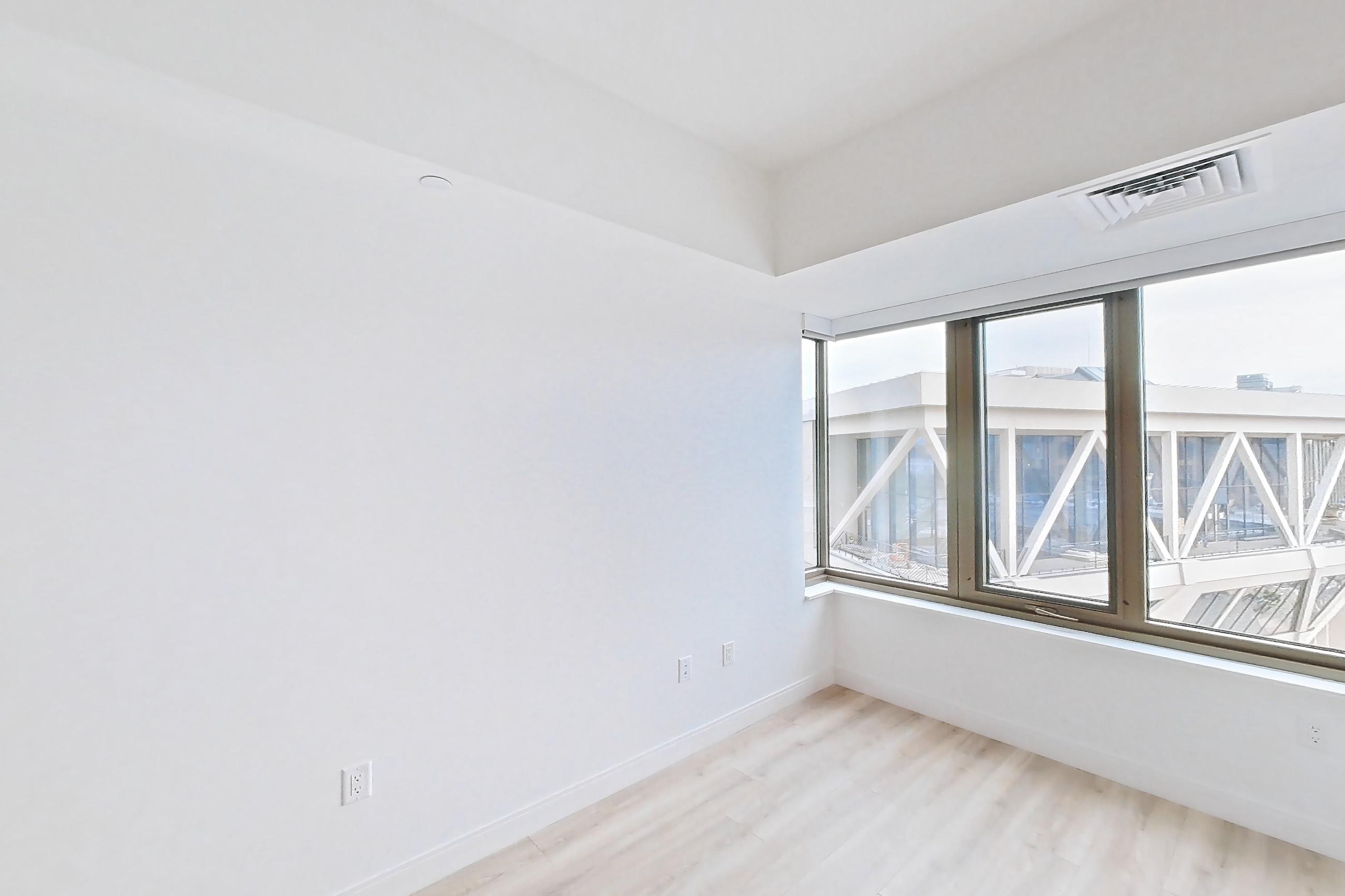 Living space with light wood-finish flooring, Apartment 526H at Verra