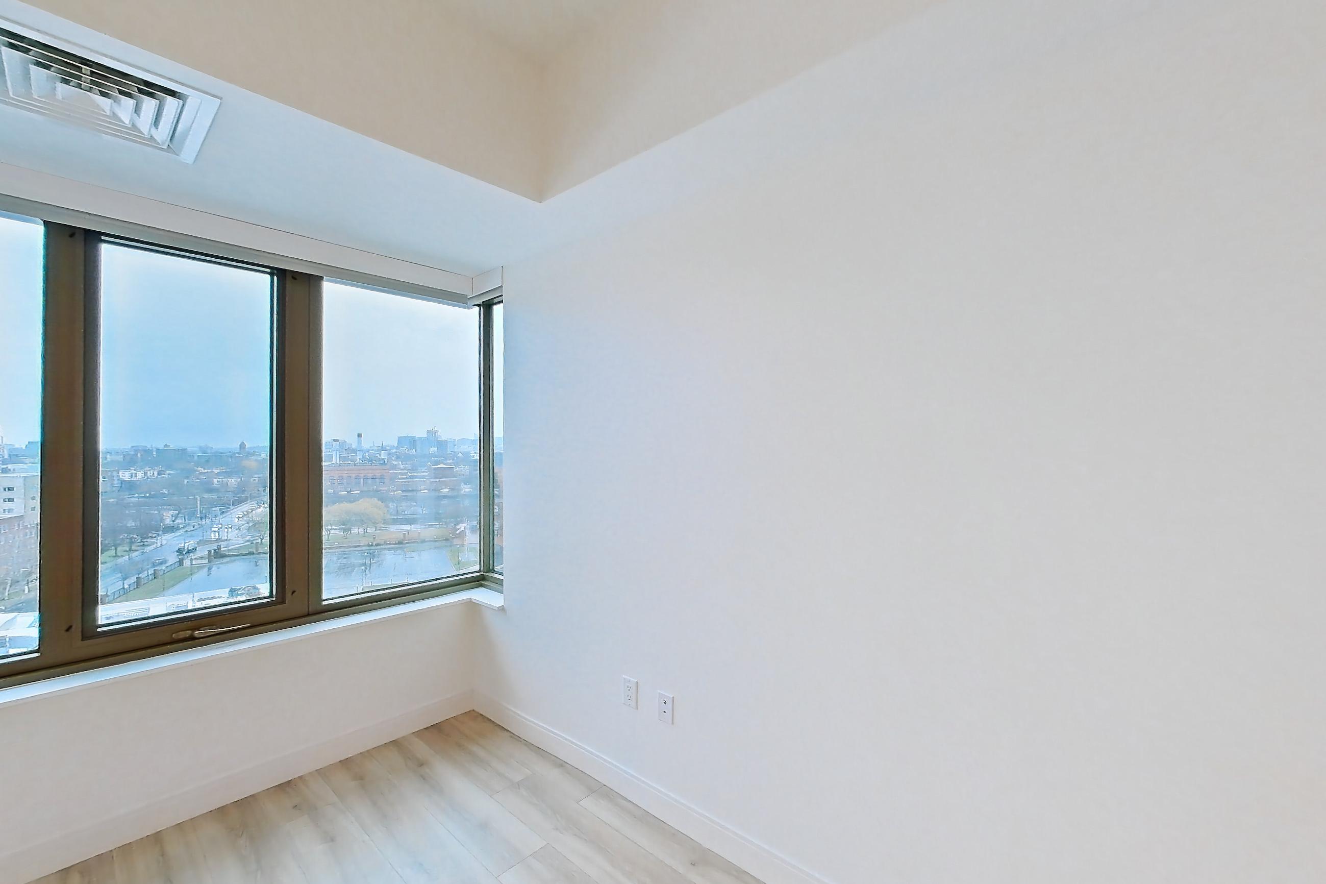 Living space with light wood-finish flooring, Apartment 1124H at Verra