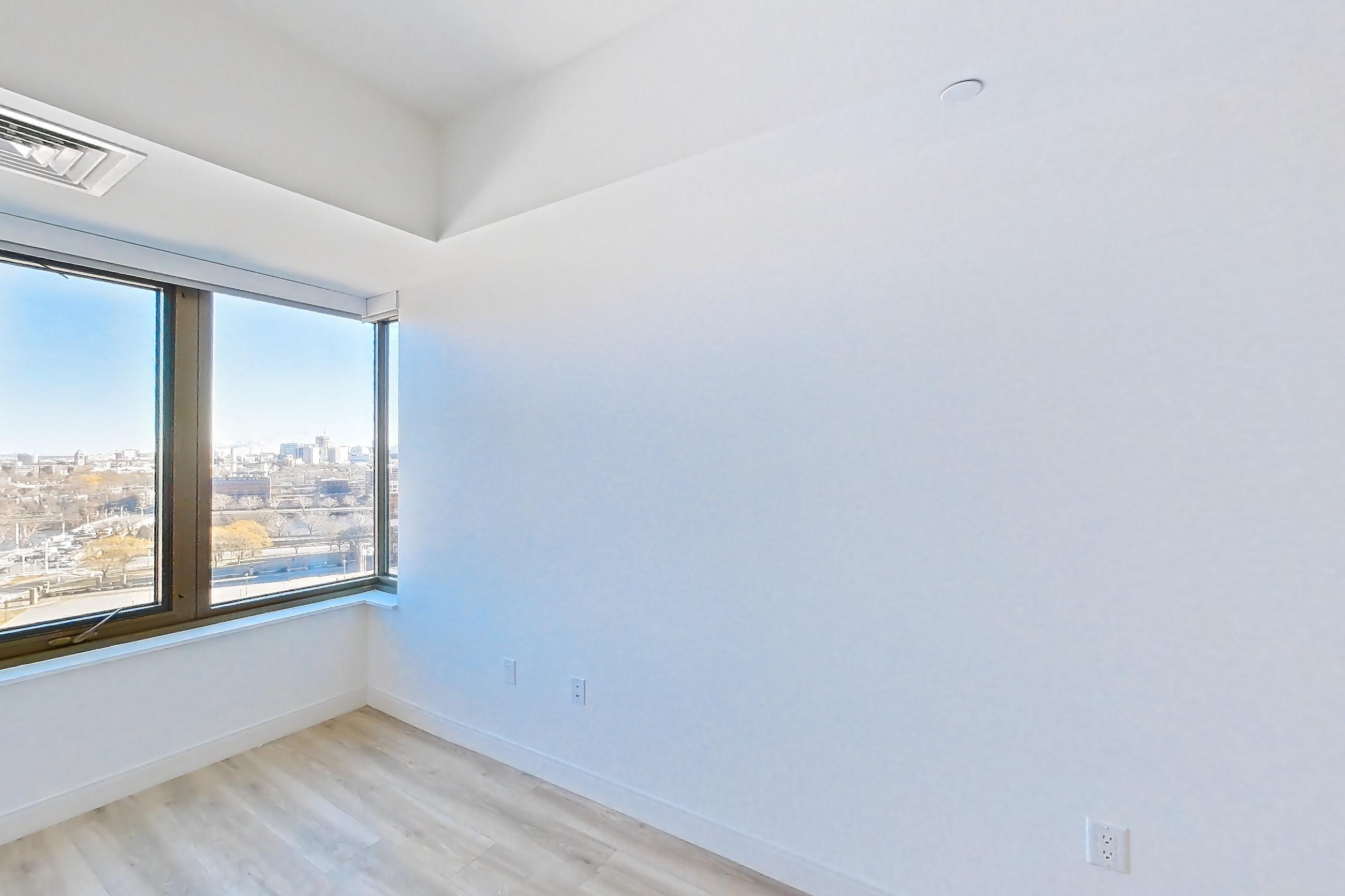 Living space with light wood-finish flooring, Apartment 1224H at Verra