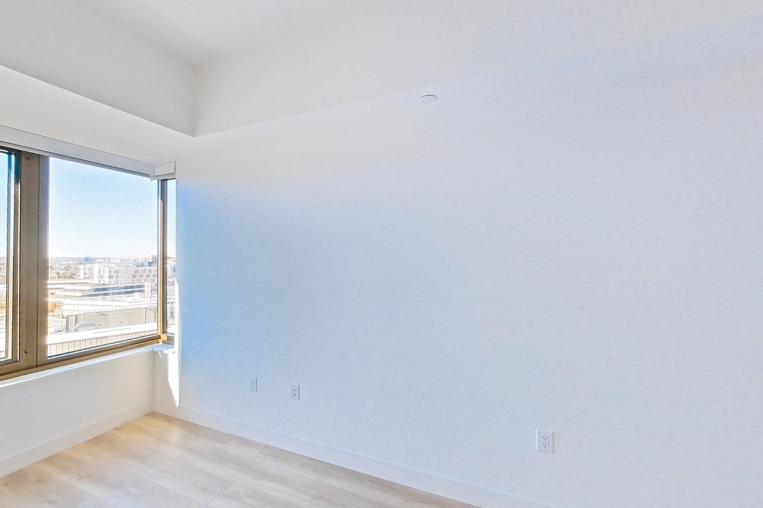 Living space with light wood-finish flooring, Apartment 1231H at Verra