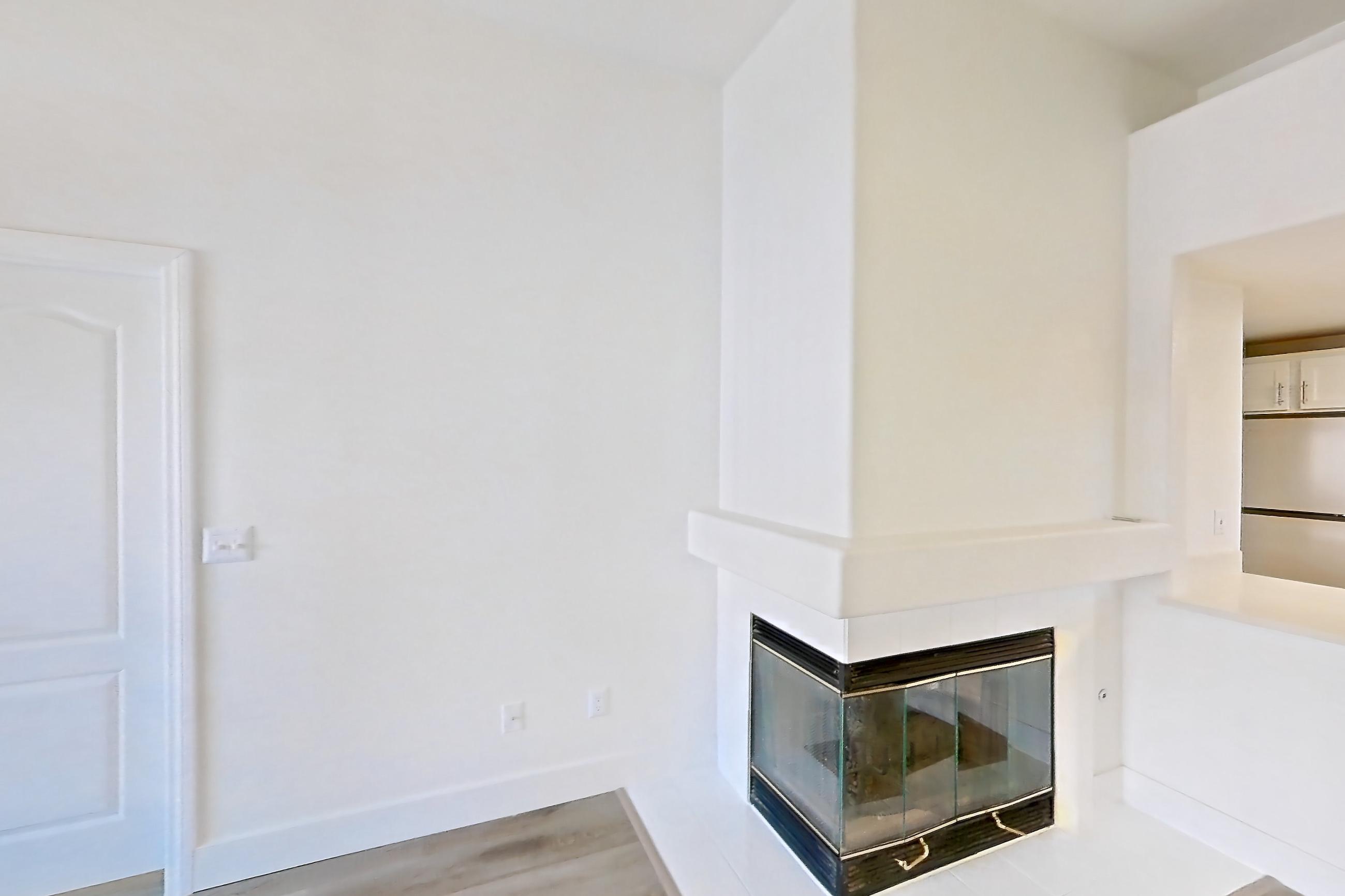 Living room with fireplace, Apartment 2001 at Monaco Park