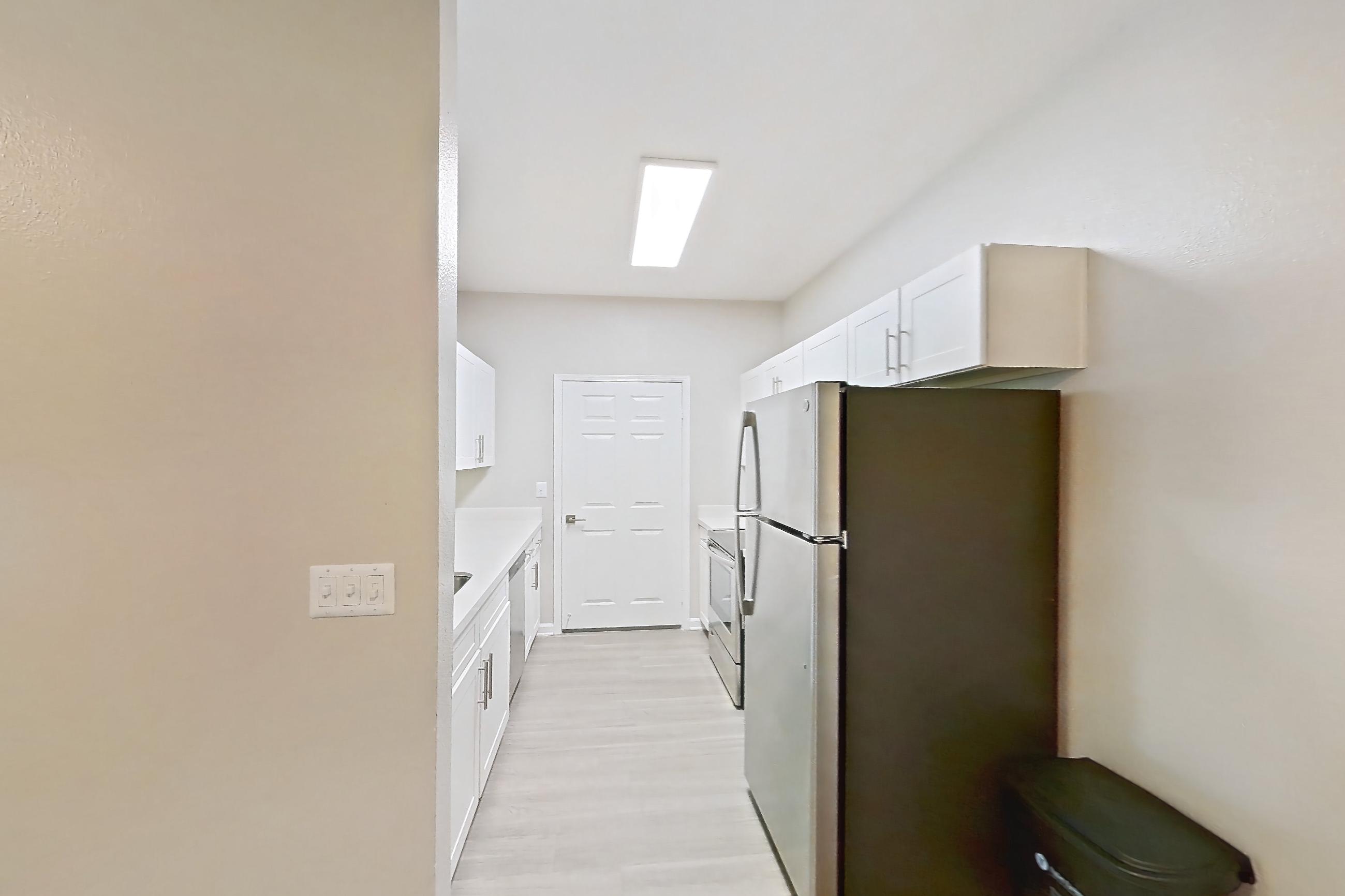 Dining room in a 2B floor plan apartment, representative of Apartment 01-2008 at Xander 3900