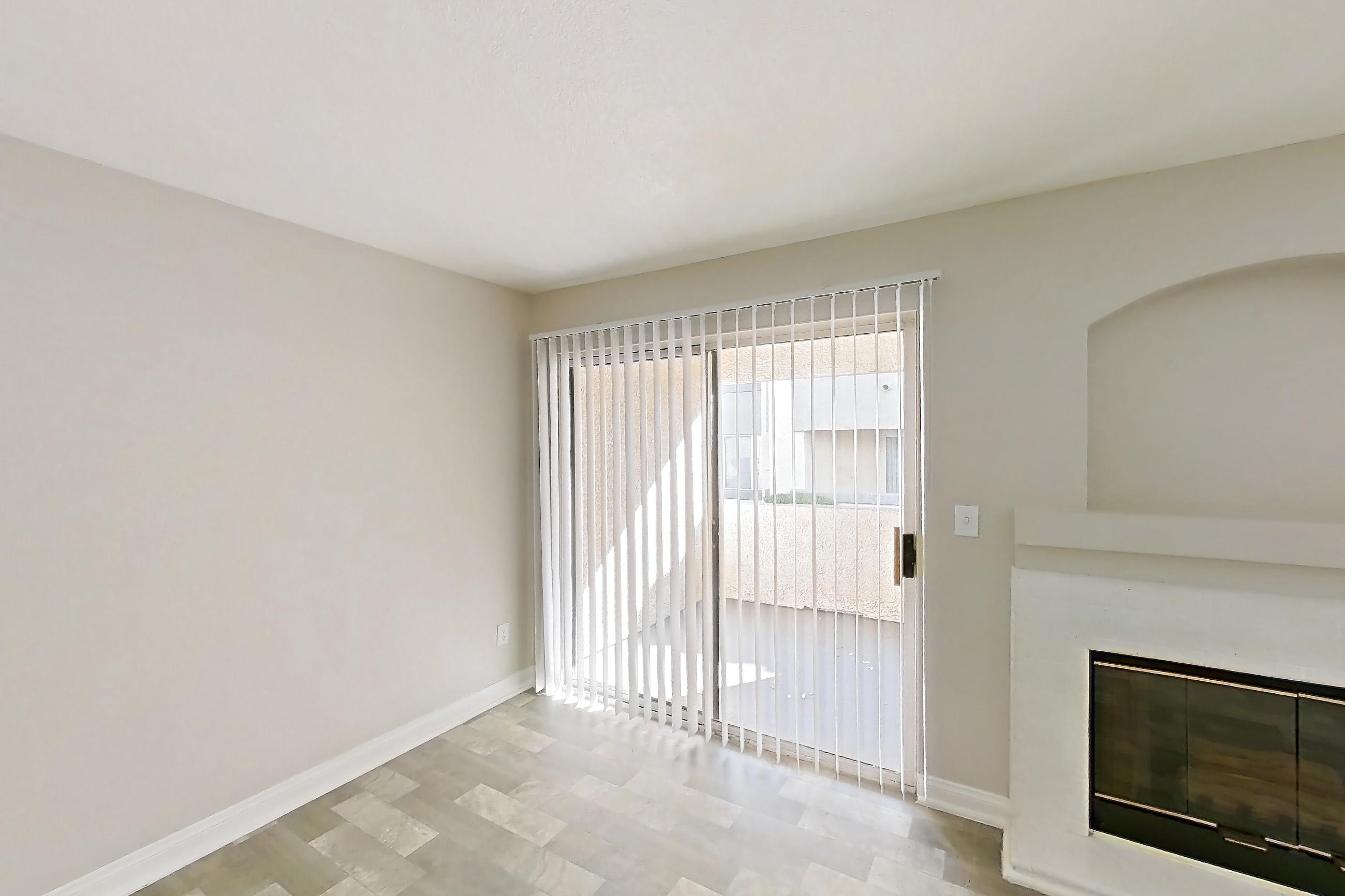 Living room with fireplace and light wood-finish flooring, Apartment 1018 at Vintage Pointe