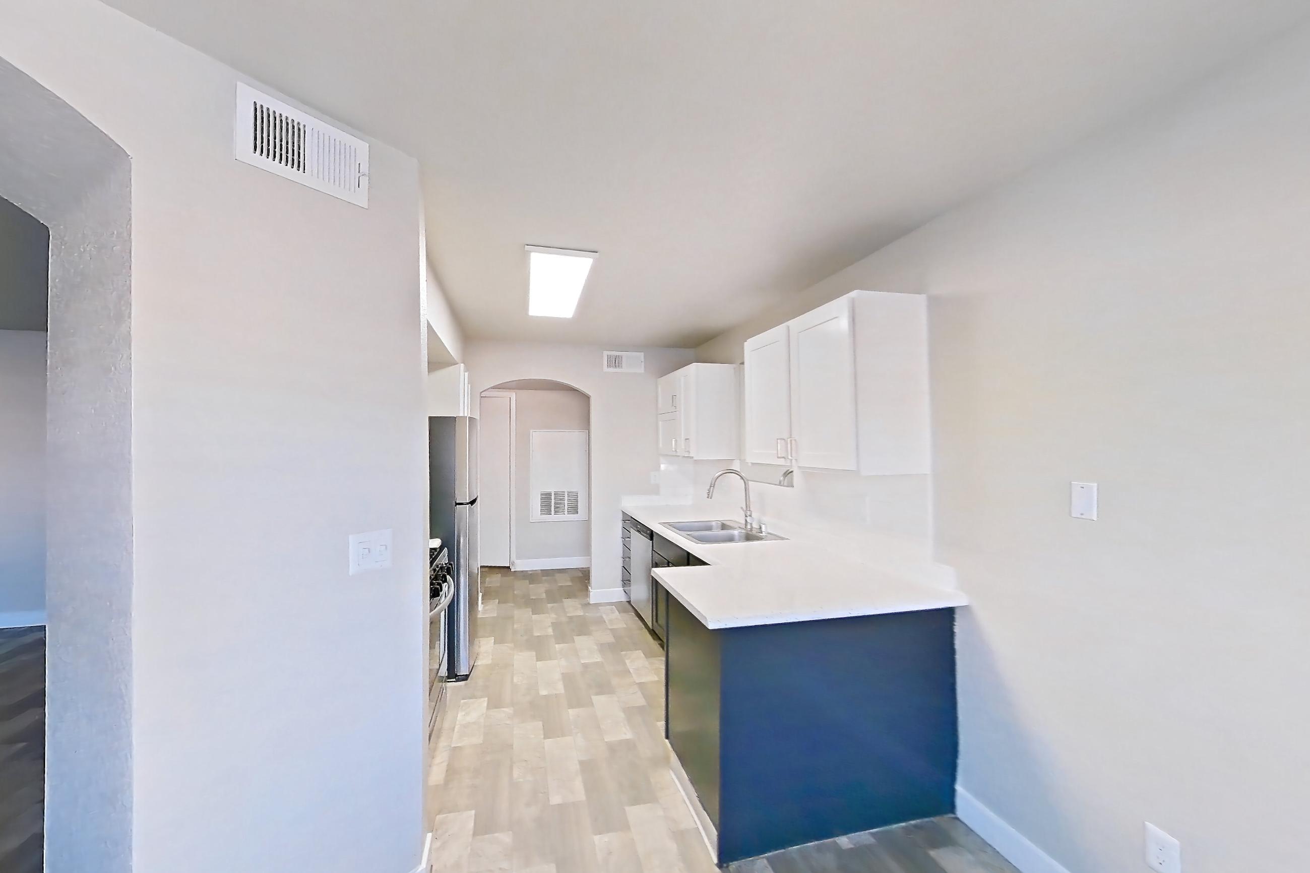 Dining room with in-unit laundry, light stone countertops, and light wood-finish flooring, Apartment 1125 at Vintage Pointe