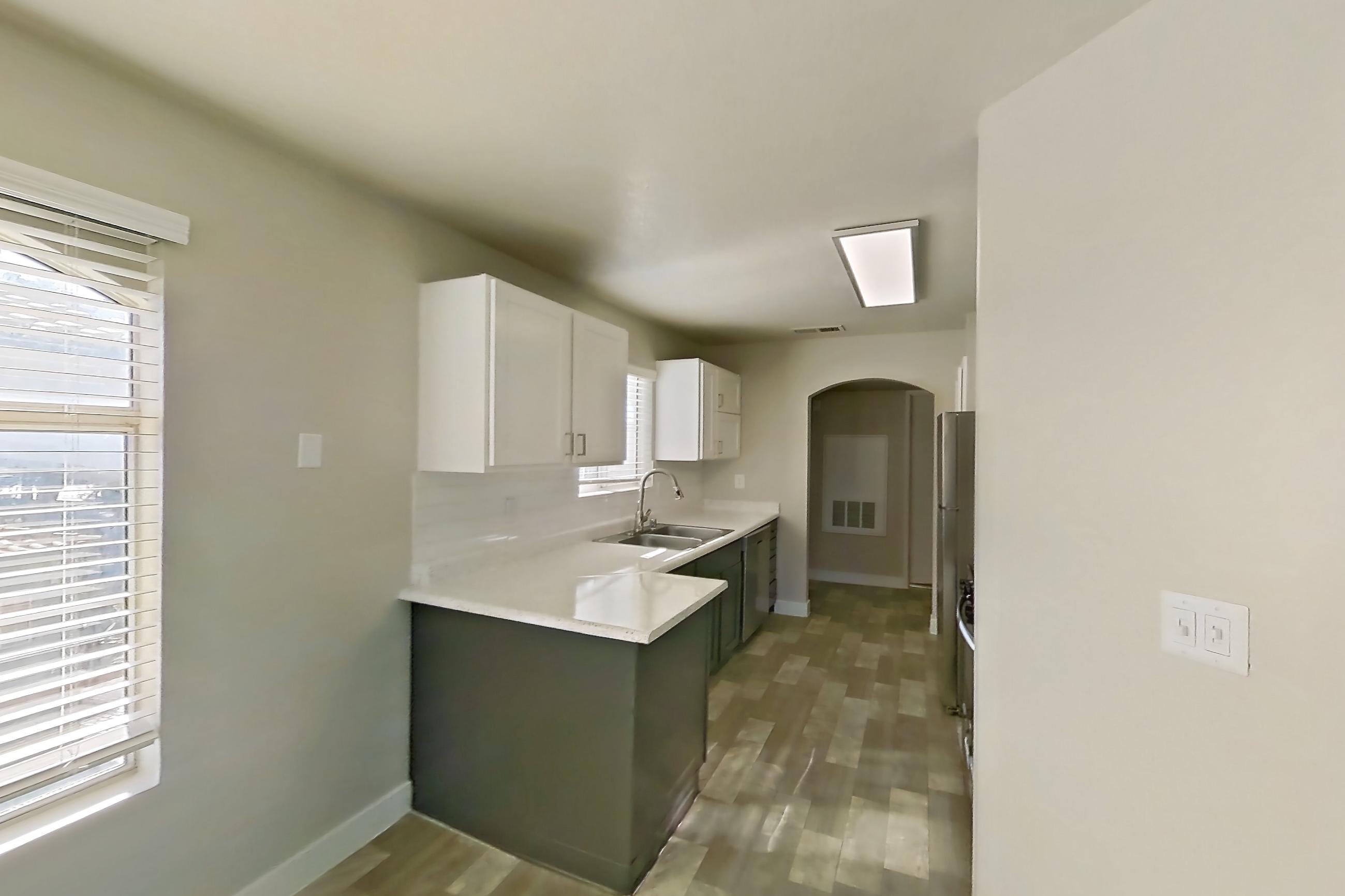 Dining room with in-unit laundry, light countertops, and light wood-finish flooring, Apartment 2004 at Vintage Pointe