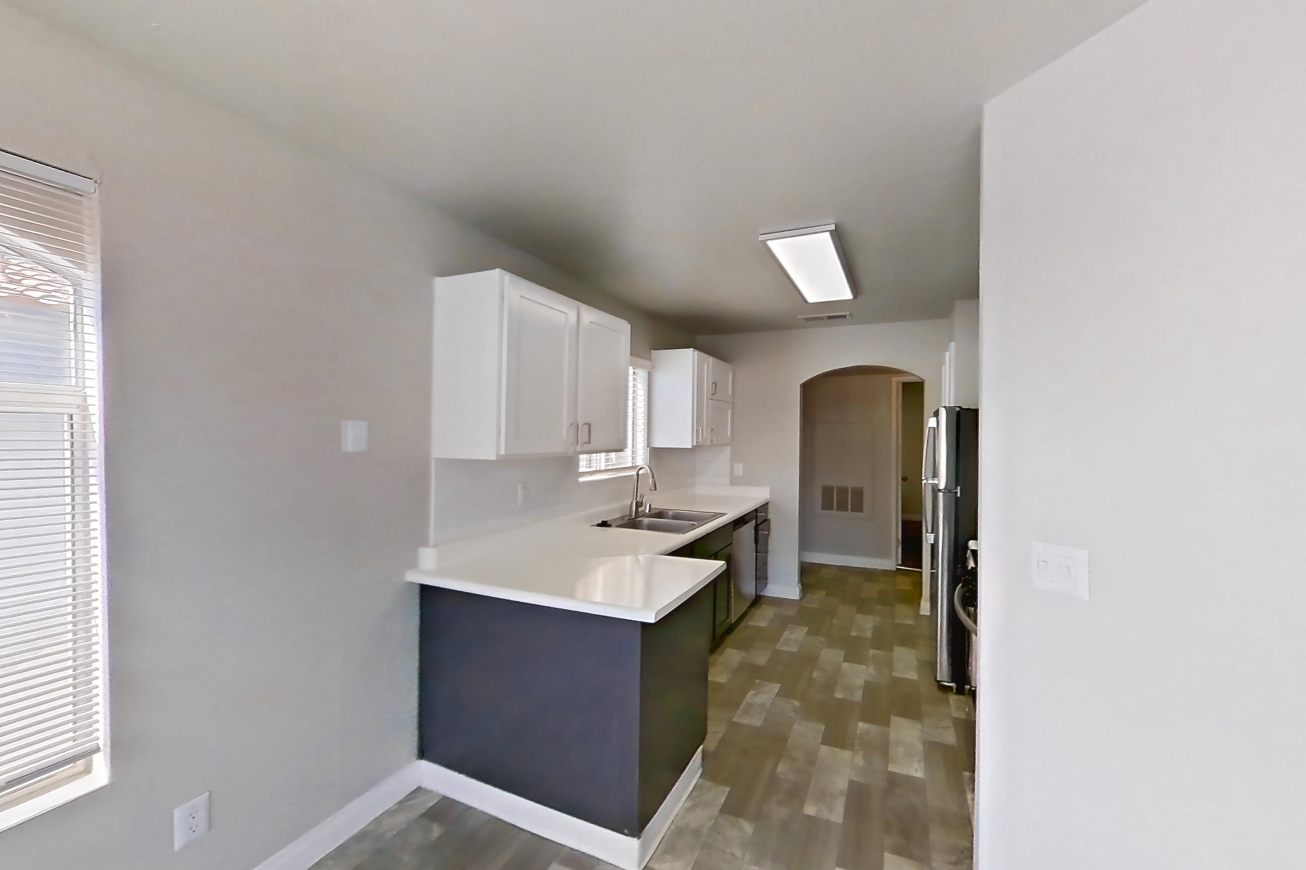 Dining room with in-unit laundry, light countertops, and light wood-finish flooring, Apartment 2042 at Vintage Pointe
